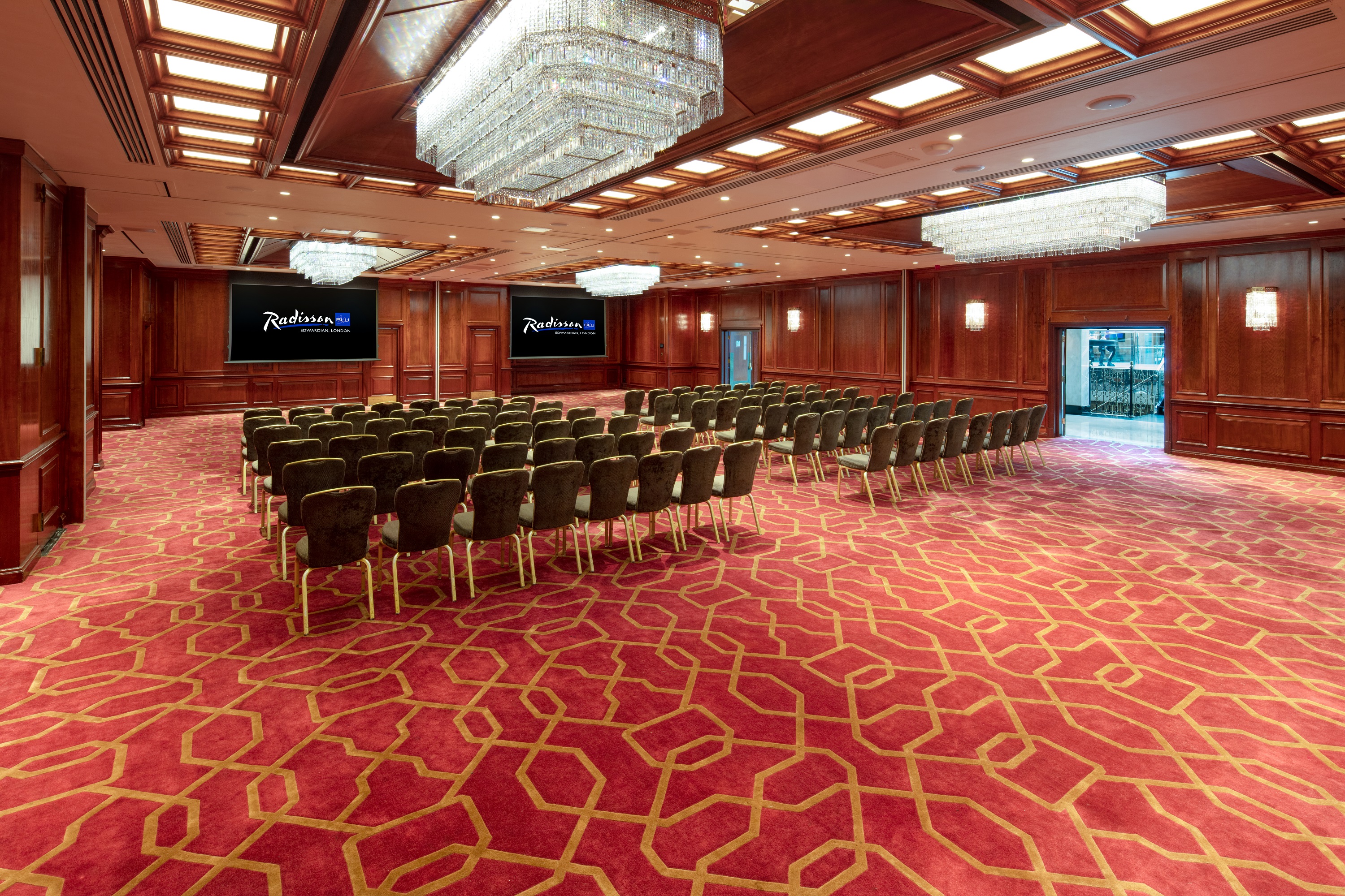 Royal Suite meeting room at Radisson Blu Heathrow with elegant chandeliers for conferences.