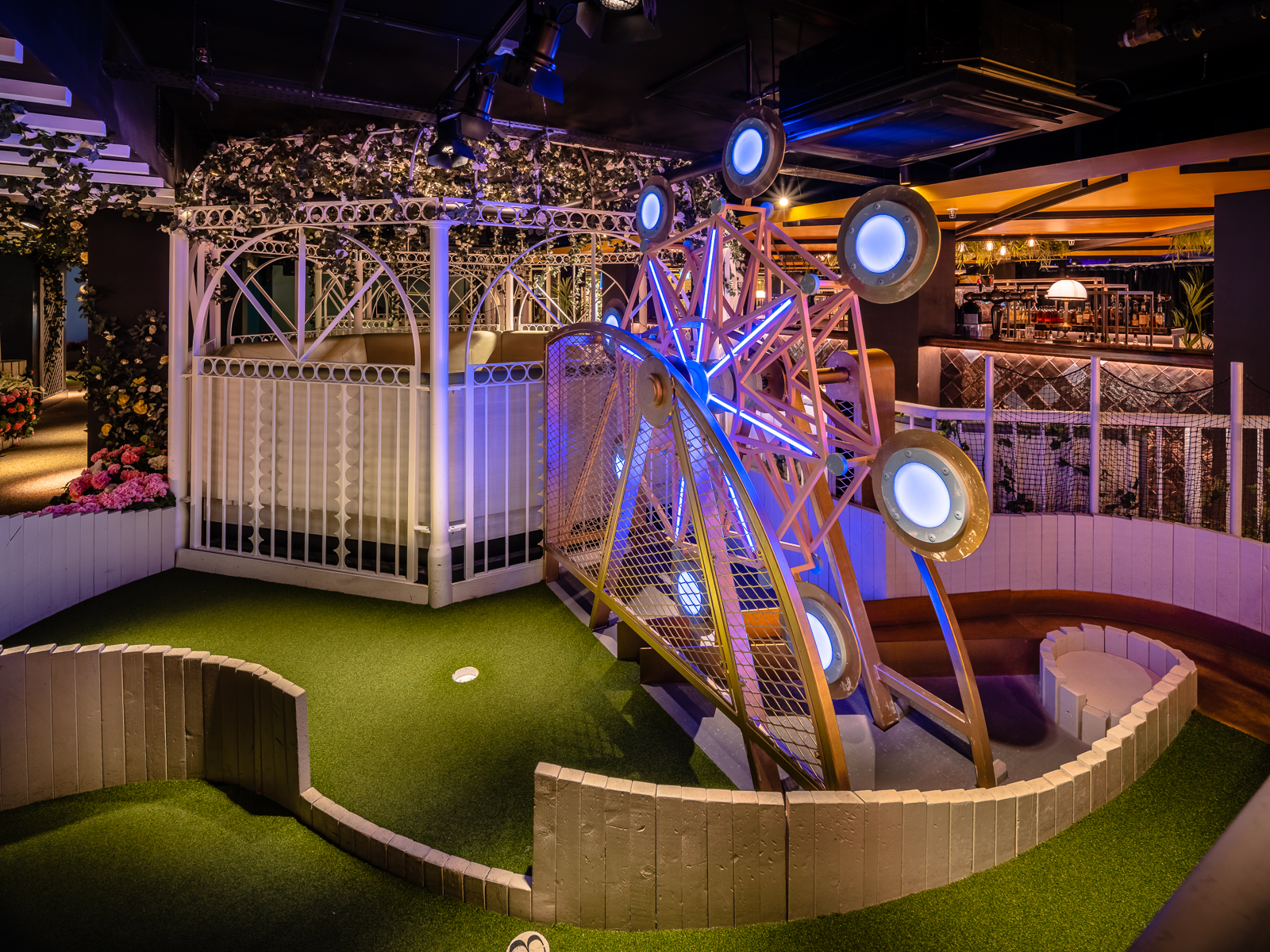 Colorful pergolas in Swingers West End, ideal for casual gatherings and team-building events.