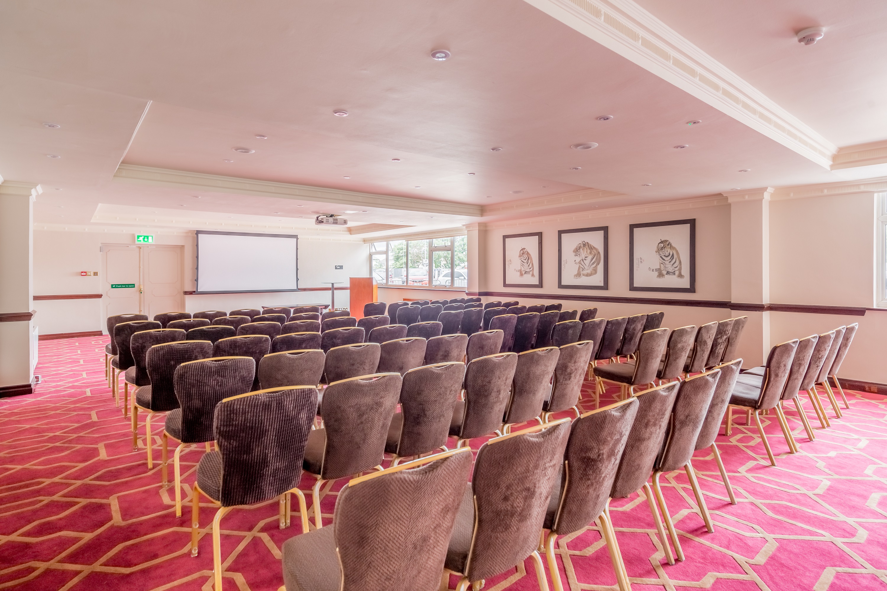 Private Room 12 at Radisson Blu Heathrow, plush chairs for conferences and workshops.