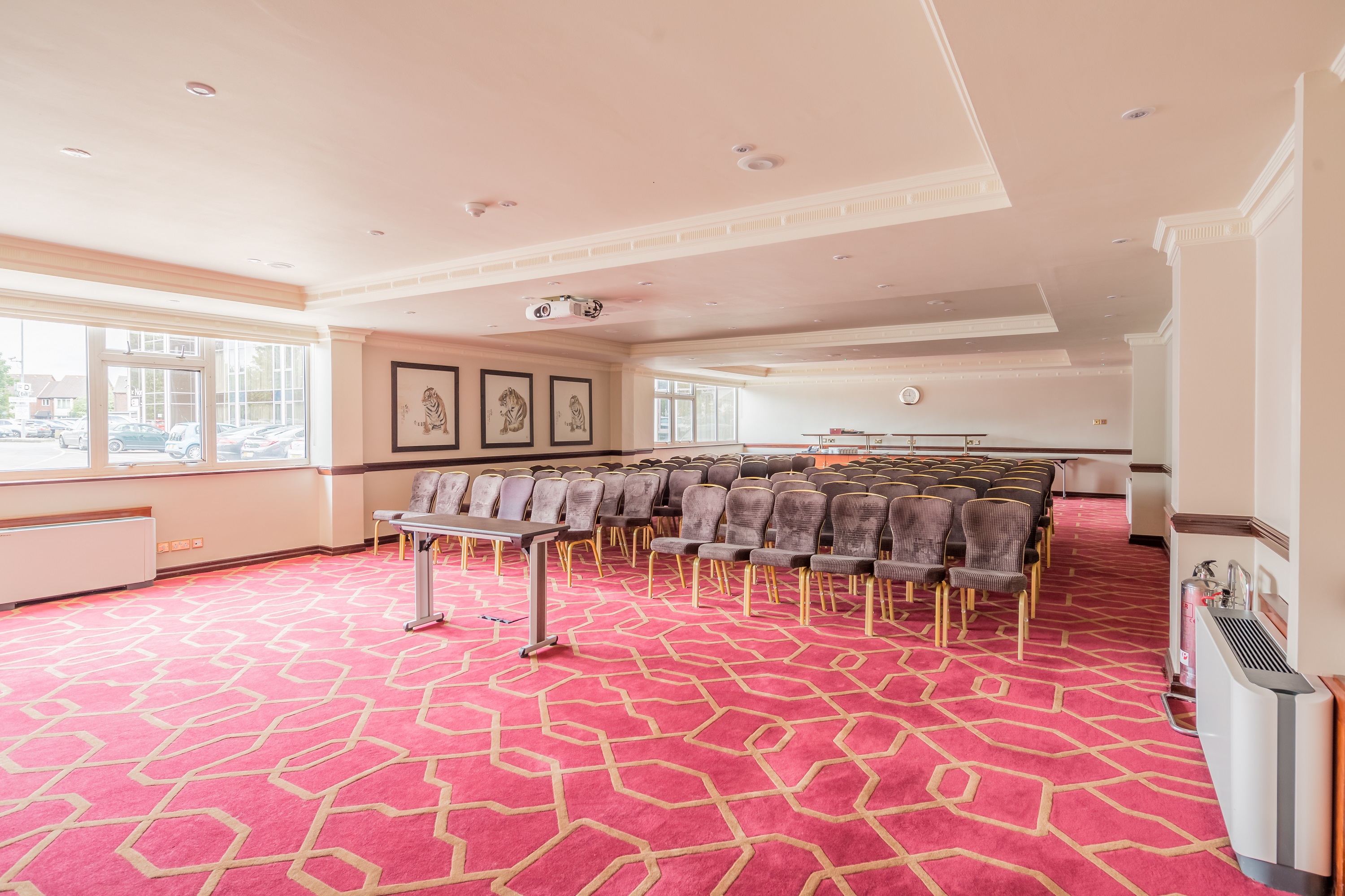 Private Room 12 at Radisson Blu Heathrow, ideal for conferences with natural light and seating.