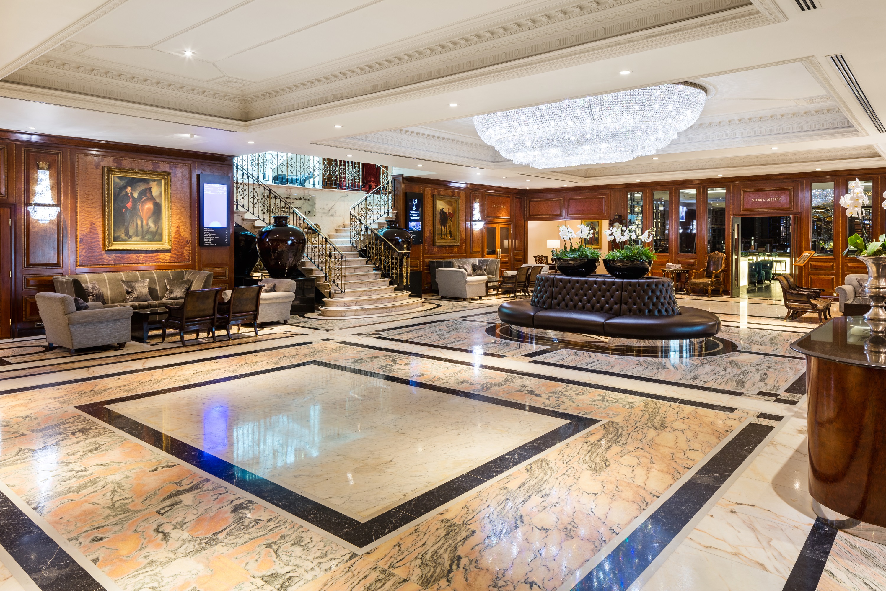 Luxurious hotel lobby with marble flooring, ideal for networking events at Radisson Blu Heathrow.