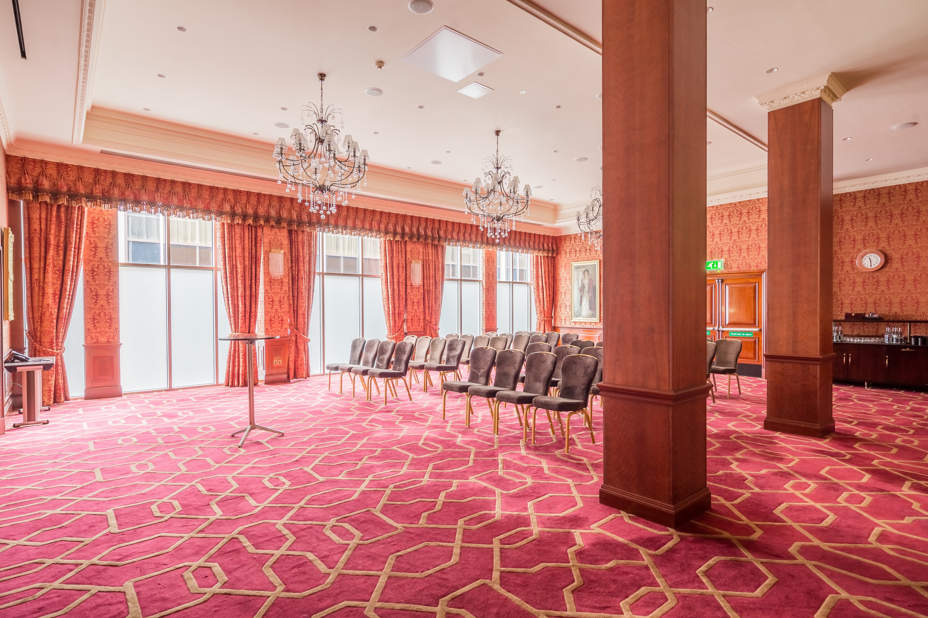 Elegant meeting room with chandeliers for corporate events and workshops at Radisson Blu.