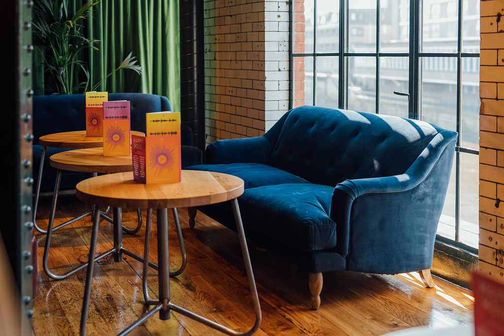 Stylish lounge in Speakeasy, Revolution York, perfect for networking events and meetings.