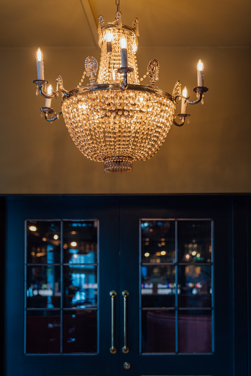 Elegant chandelier in The Clubroom, Revolution York for upscale events and celebrations.