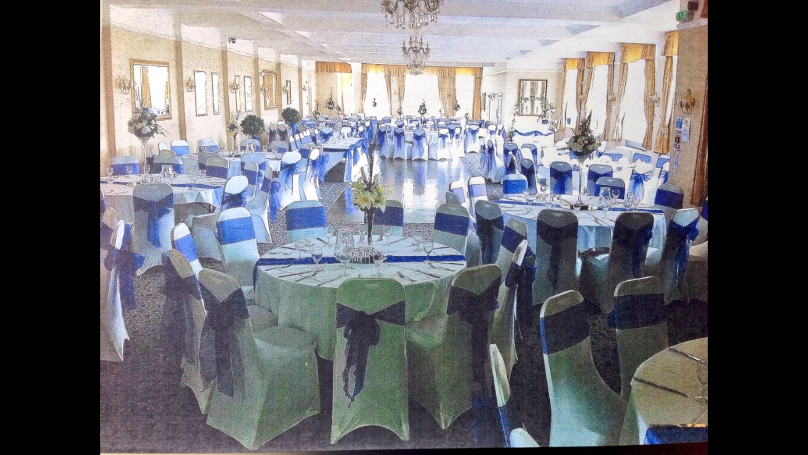 Belmont Suite at Best Western Thurrock: elegant wedding venue with round tables and floral decor.