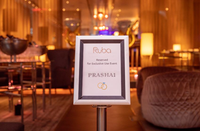 "TwoRuba Bar reserved sign for exclusive live event in stylish Hilton London venue."
