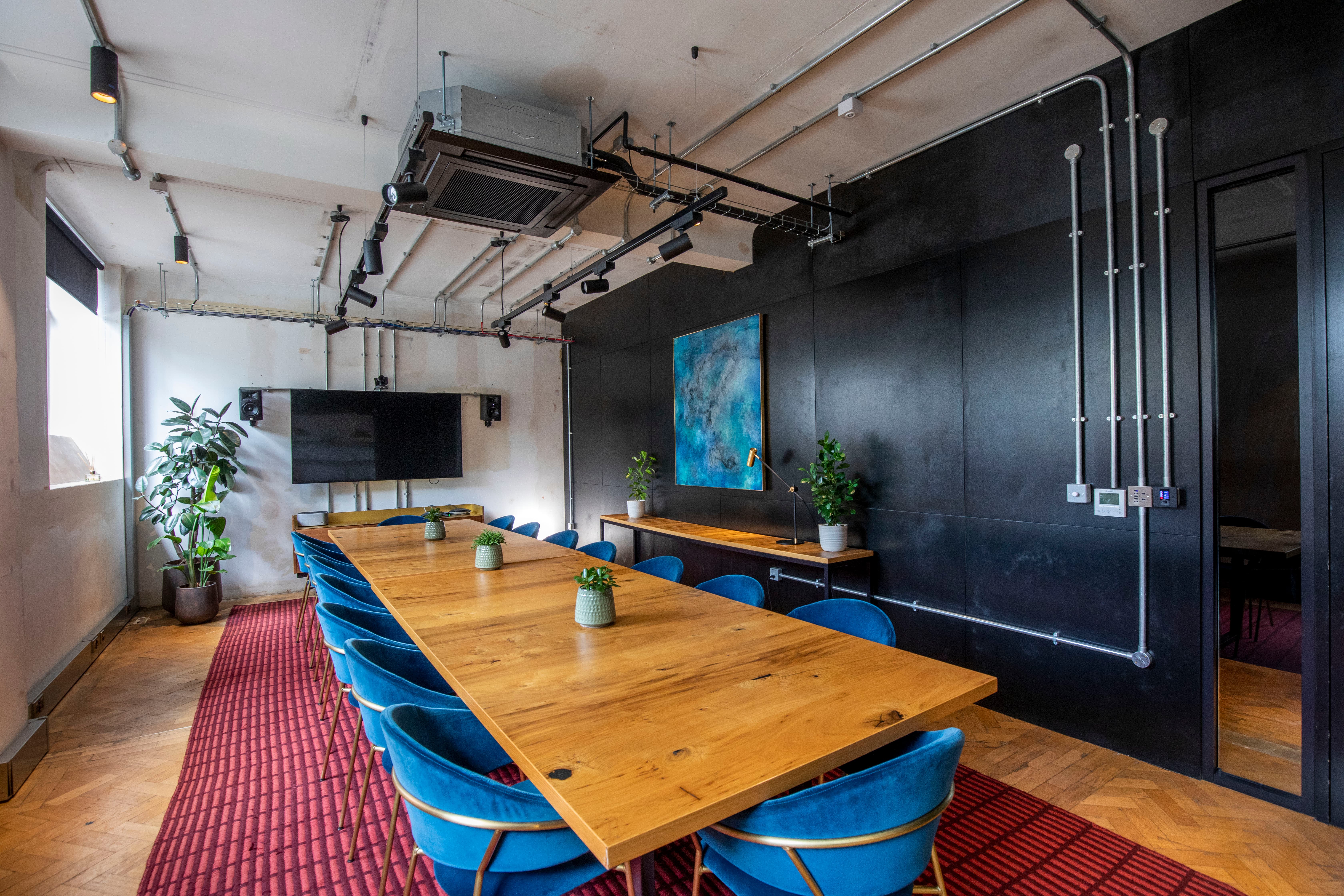 Industrial boardroom at The Ministry featuring long-format table for workshops and strategy sessions.