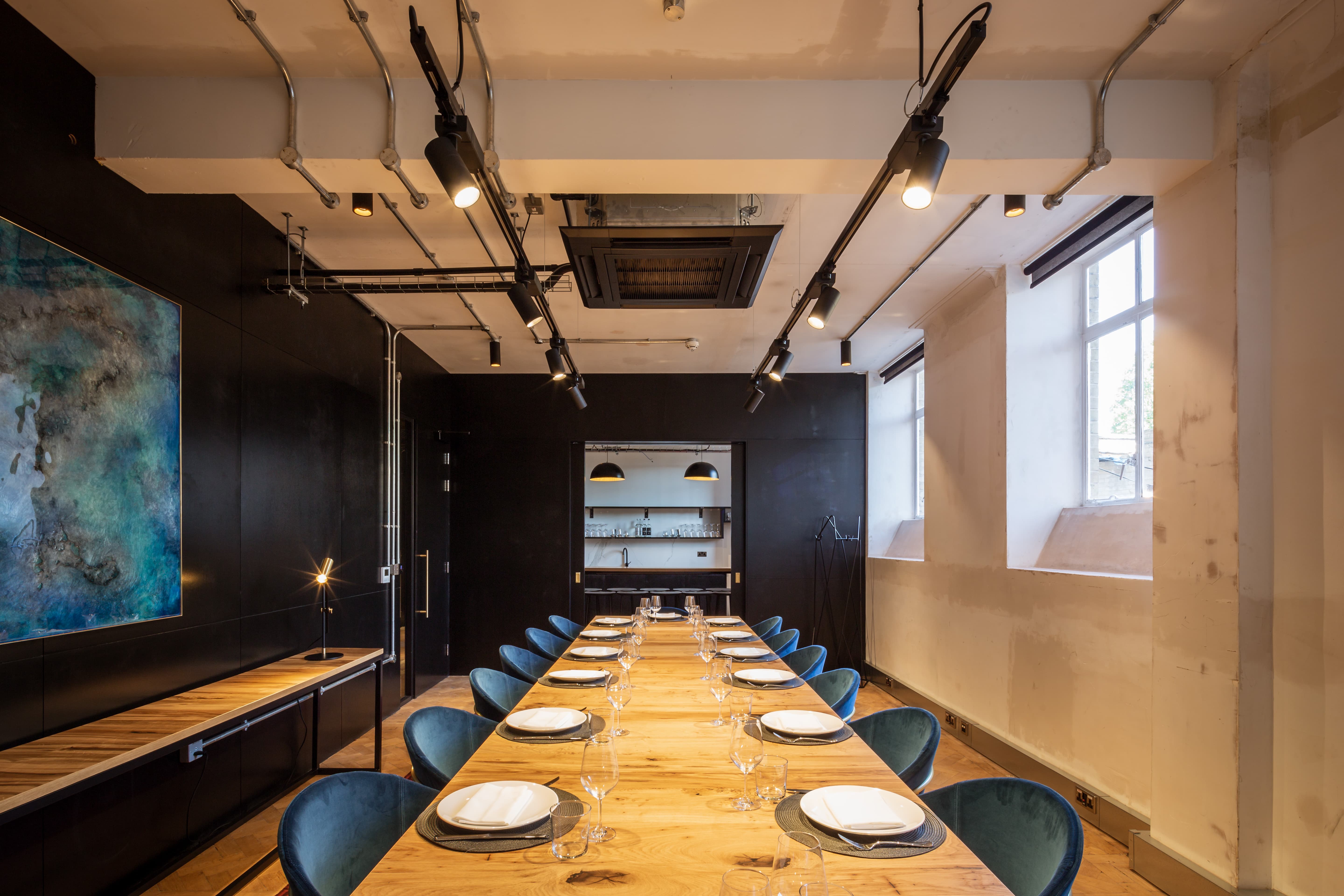 Industrial-chic boardroom in The Ministry for executive dinners and strategic workshops.