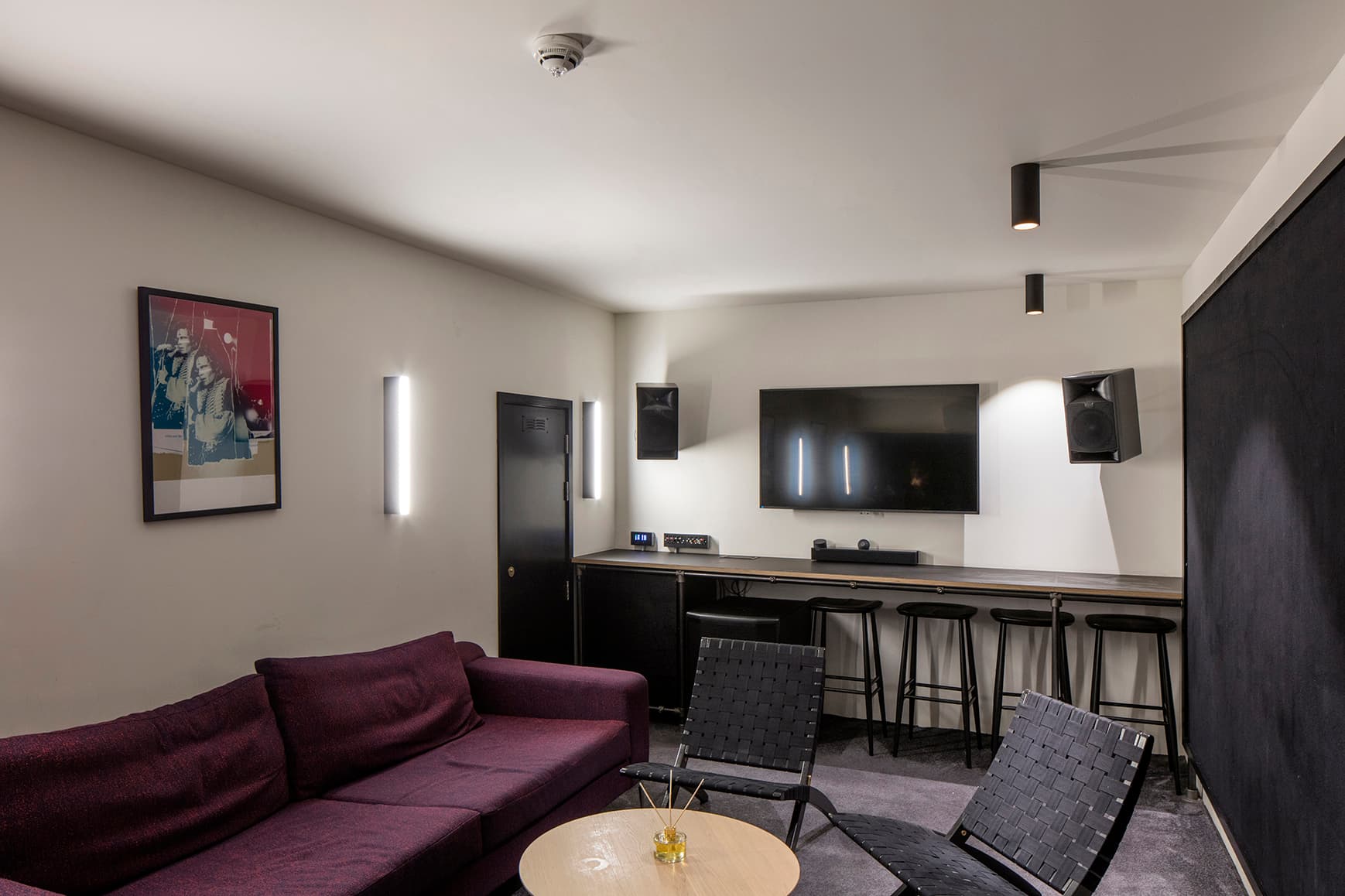 Modern huddle room at The Studio in The Ministry for hybrid meetings and corporate strategy sessions.