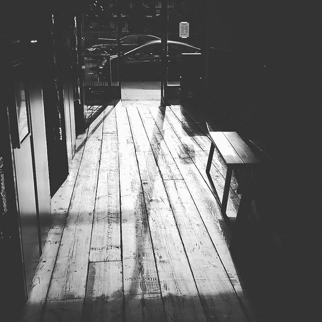 Well-lit corridor with wooden flooring, perfect for networking and workshops at Indiebeer.