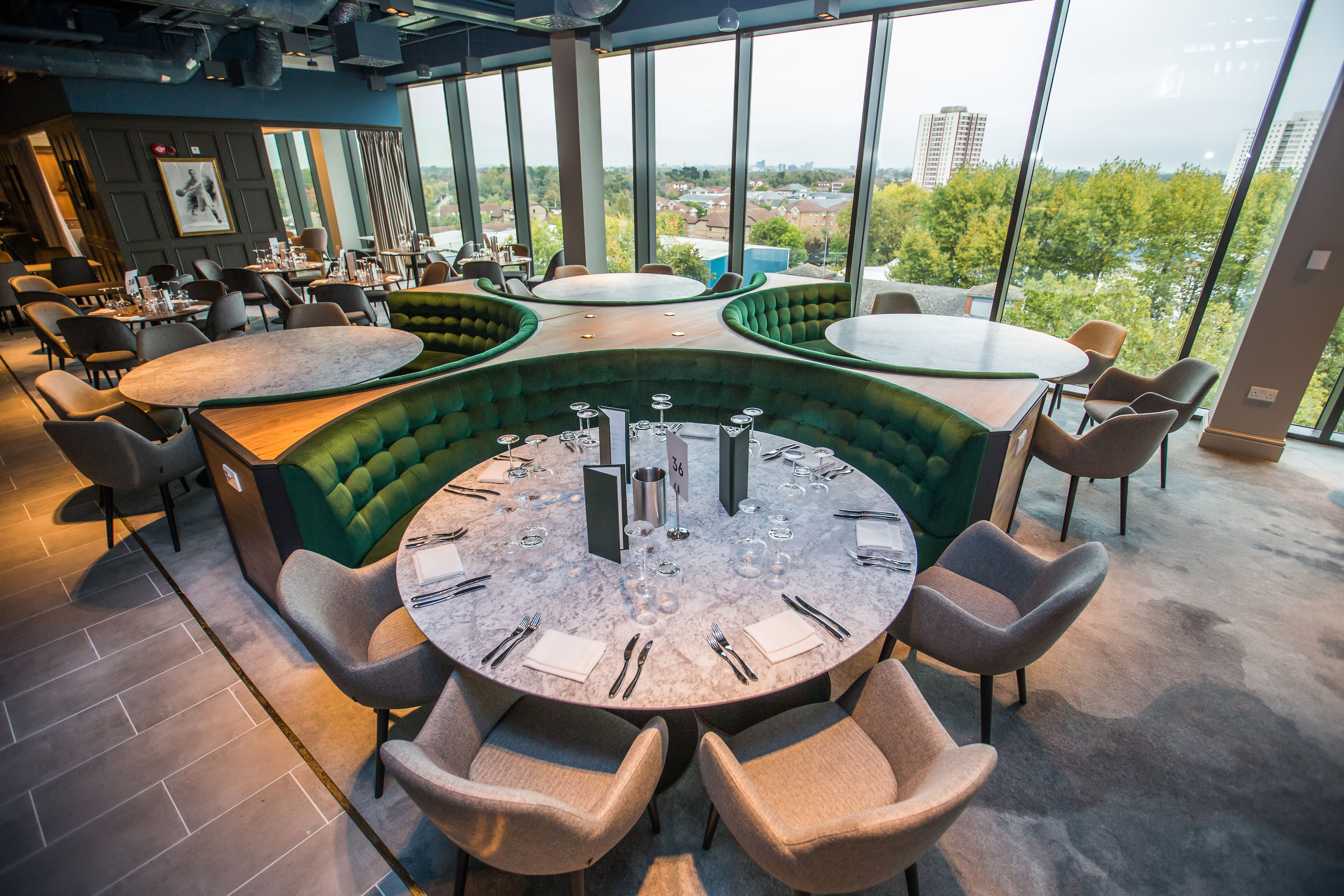 Modern dining space in Allianz Stadium, Twickenham for events with elegant round tables.