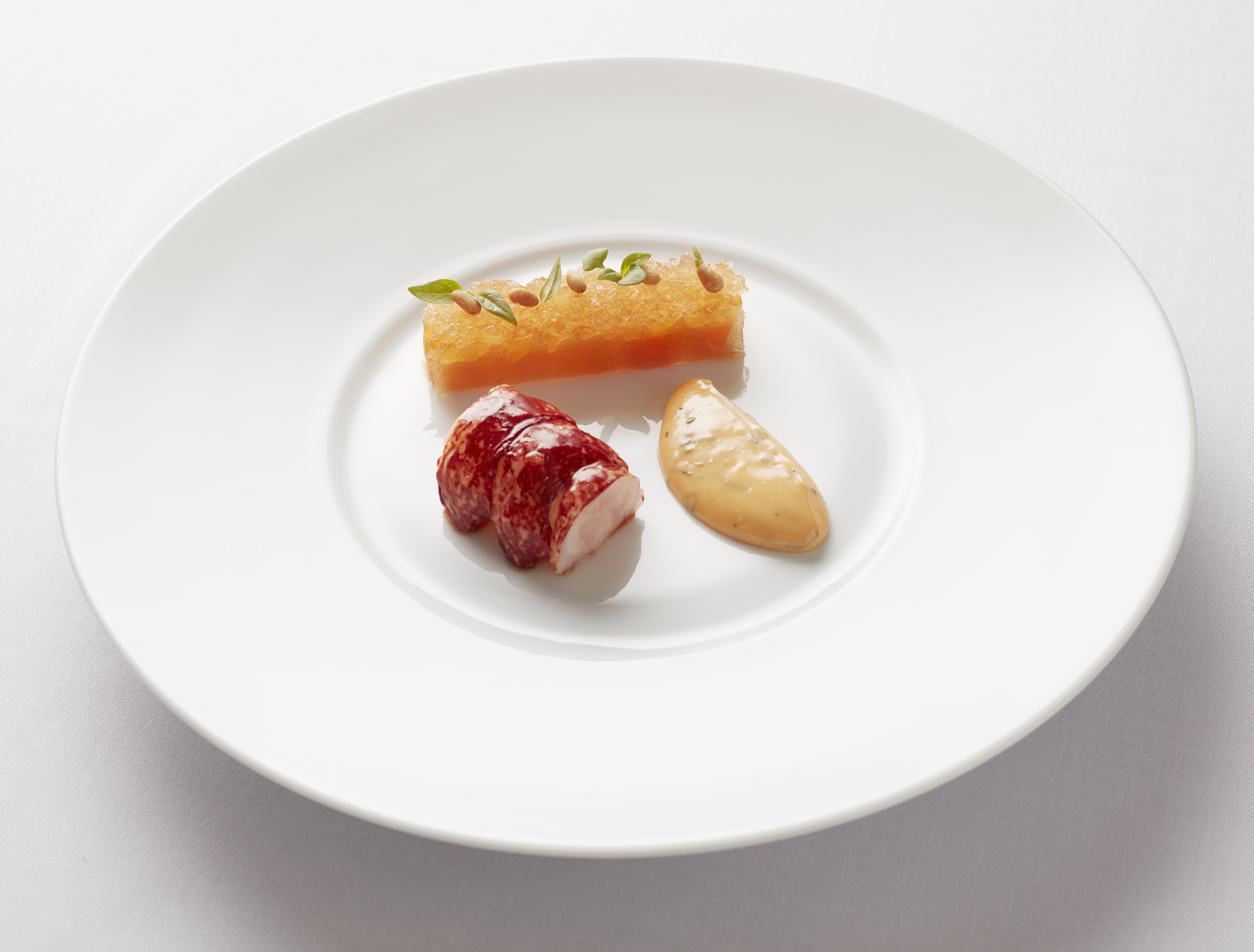 Elegant lobster dish with fruit gel at Flemings Mayfair for upscale receptions.