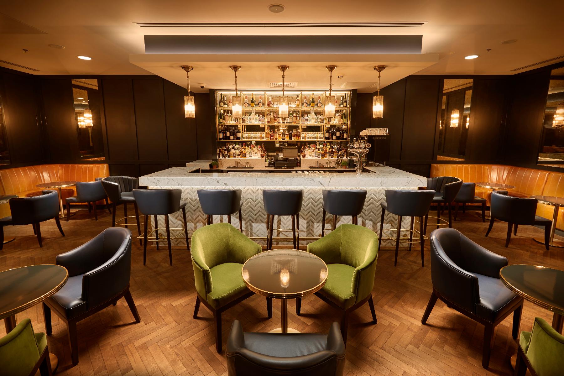 Stylish bar area in Marlin Waterloo with plush seating, ideal for networking events.