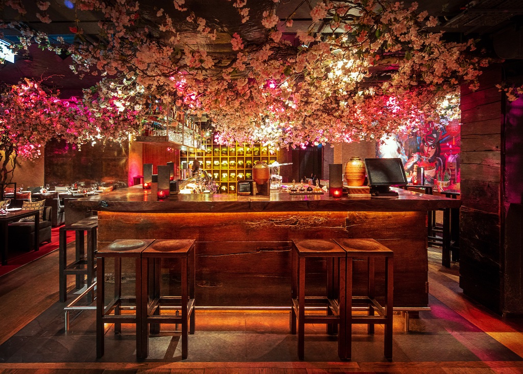 Shochu Lounge bar with floral decor, ideal for upscale events and cocktail receptions.