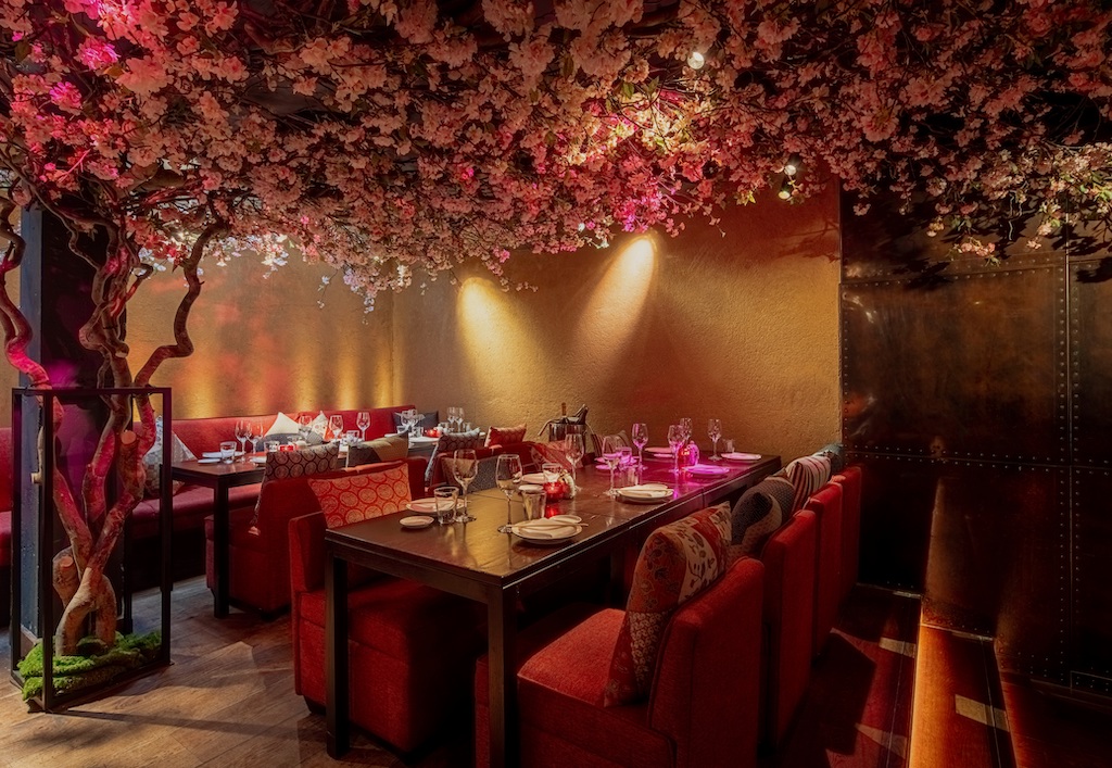 Elegant Shochu Lounge with plush seating and floral canopy for upscale events.