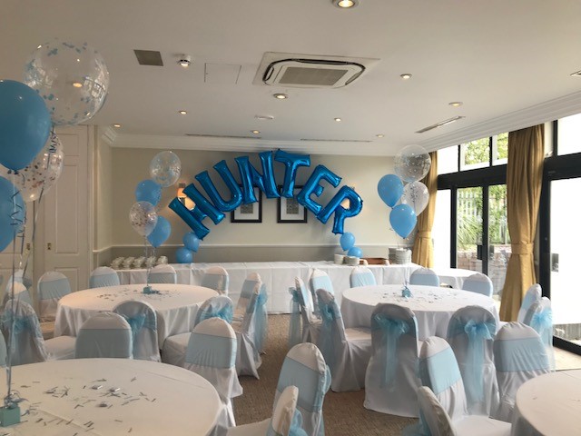 Cheshire Suite event space with blue decor and "HUNTER" balloon for celebrations.