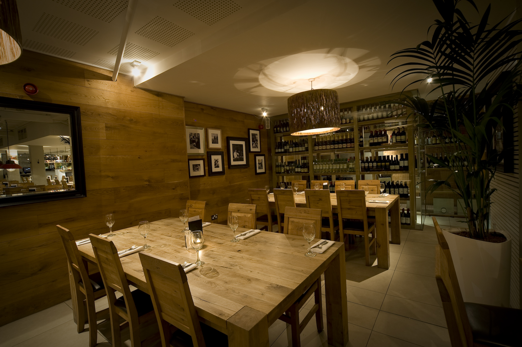 Intimate dining space with warm wood tones for networking dinners and private events.