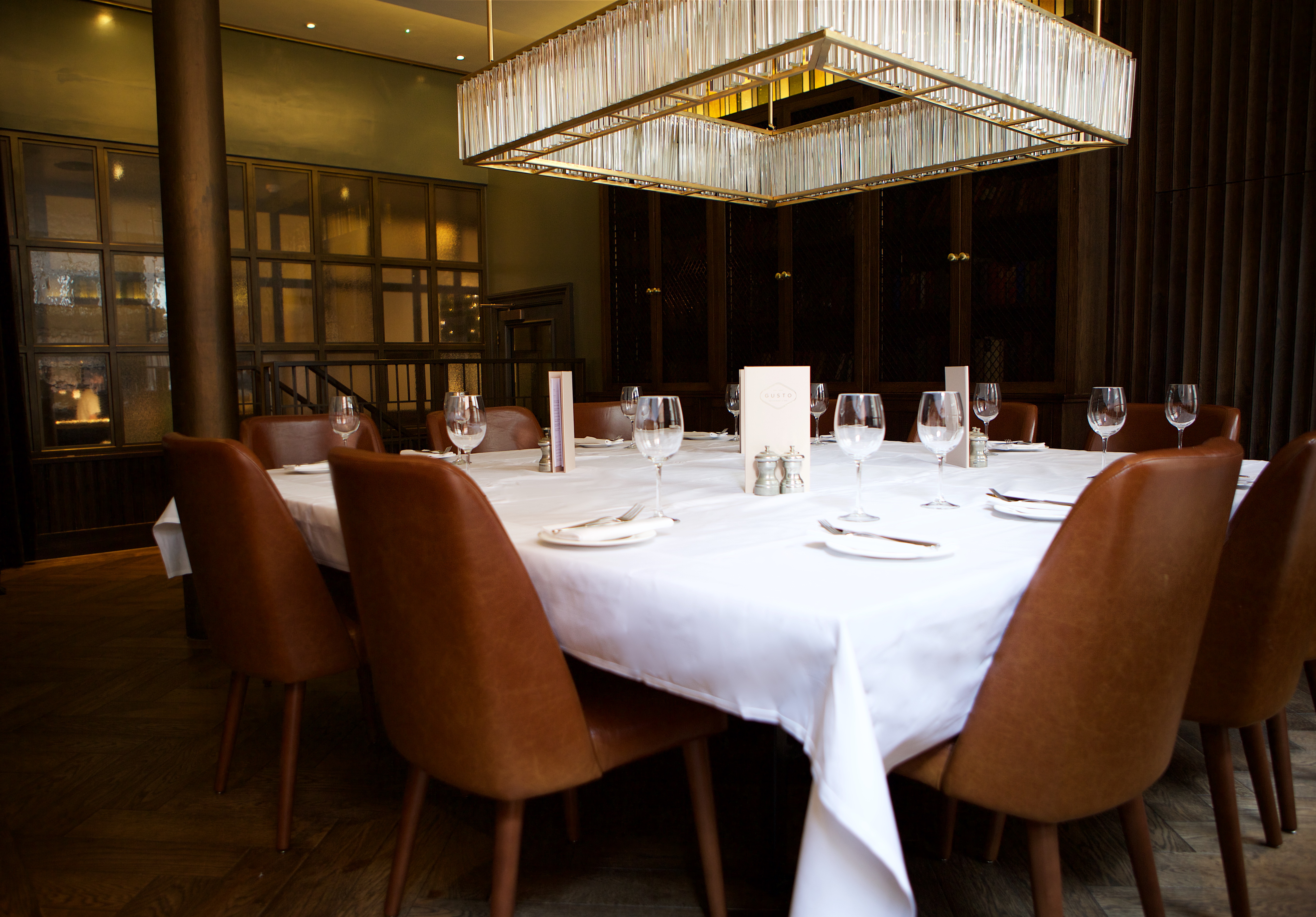 Private dining room at Gusto Manchester, elegant setup for intimate events and meetings.