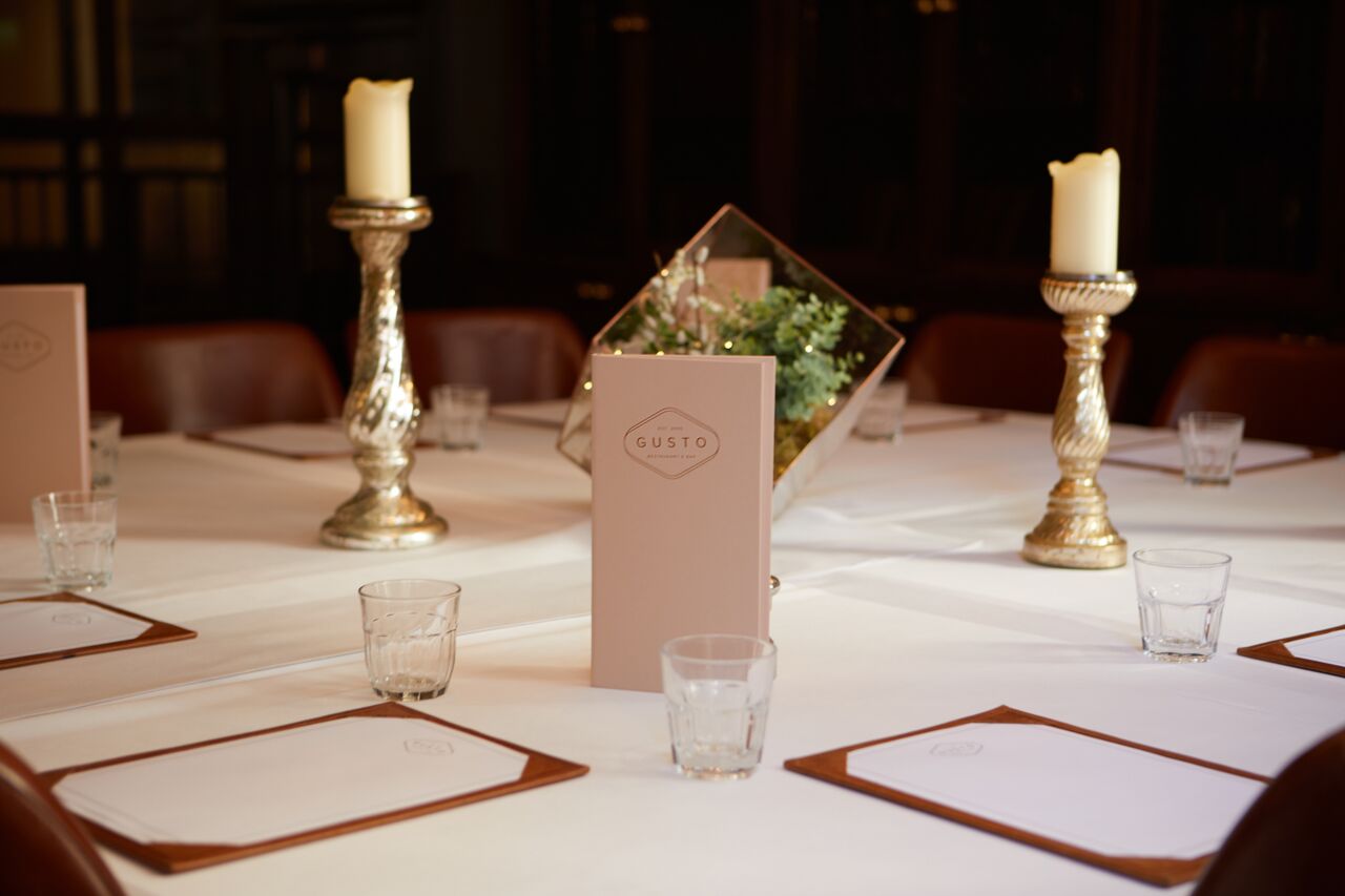 Private dining room at Gusto Restaurant, elegant table setup for corporate events.