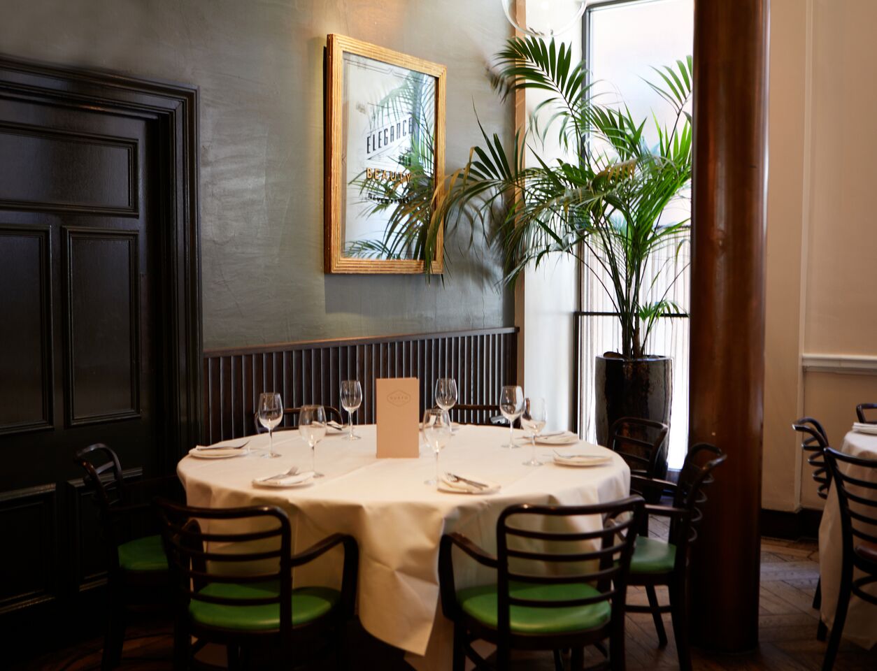 Elegant round table setup for upscale events at Gusto Restaurant, Manchester.