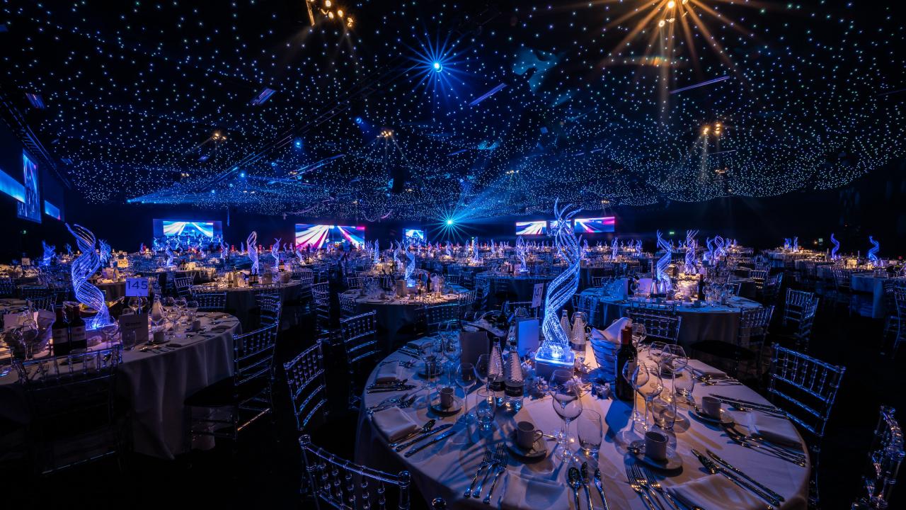 Exclusive Christmas Party at Evolution London with elegant tables and starry ceiling.