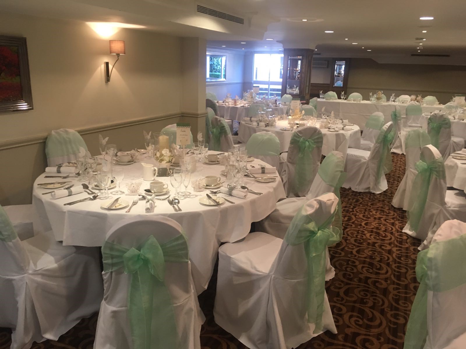 Tatton Suite banquet room with elegant tables, perfect for weddings and formal events.