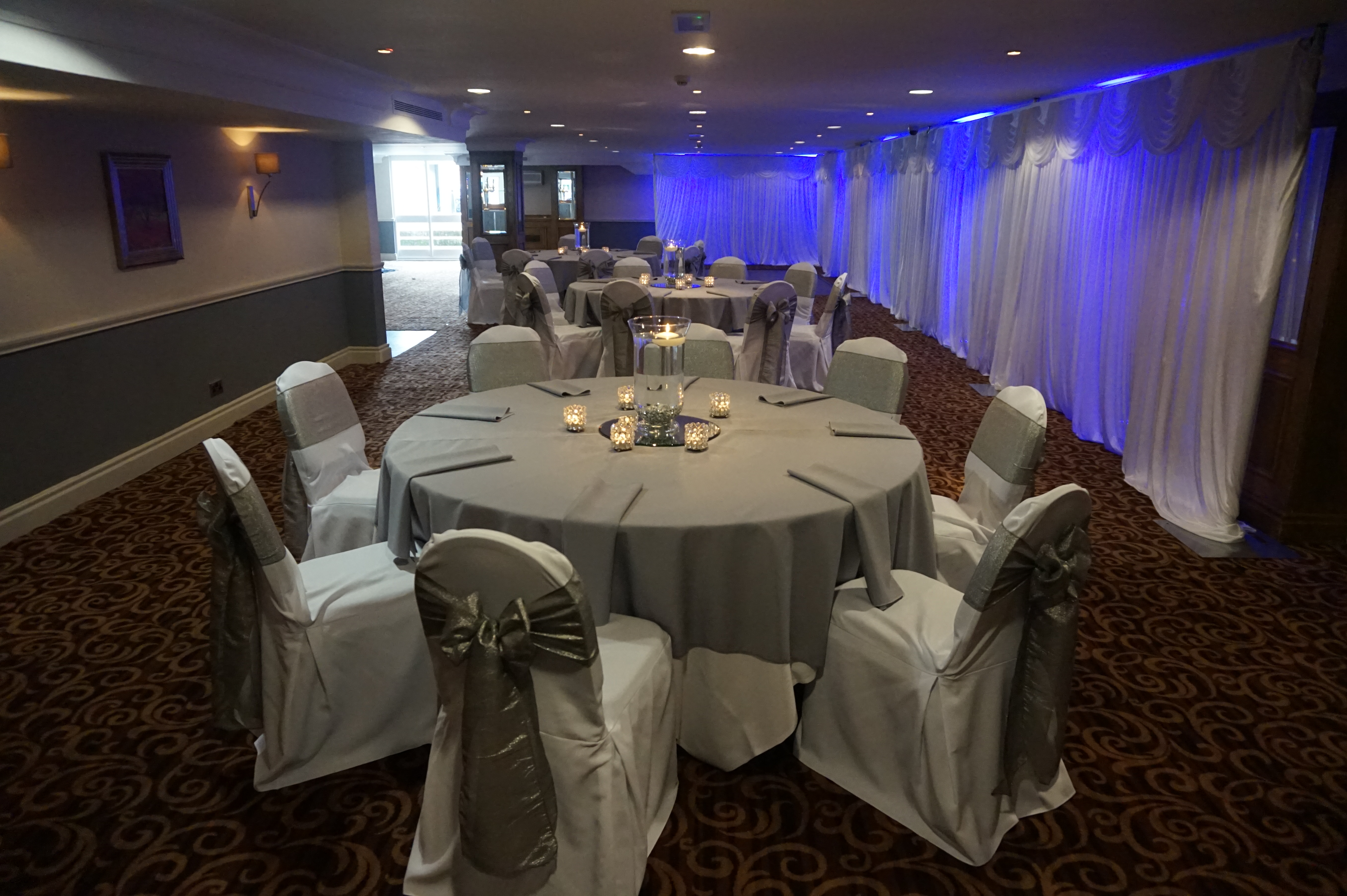 Tatton Suite event space with elegant tables, ideal for formal gatherings and celebrations.