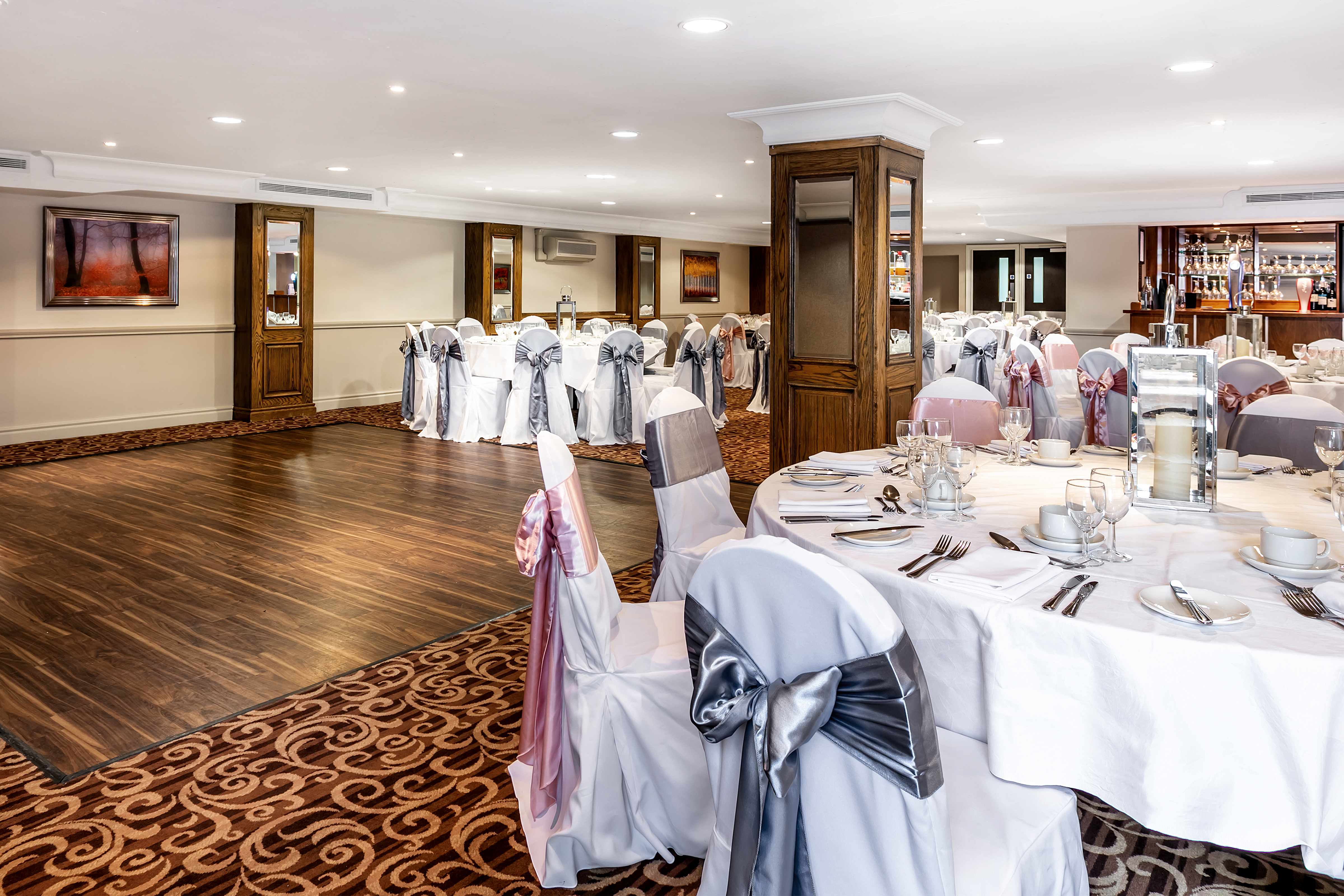 Tatton Suite event space with elegant tables, perfect for weddings and corporate events.