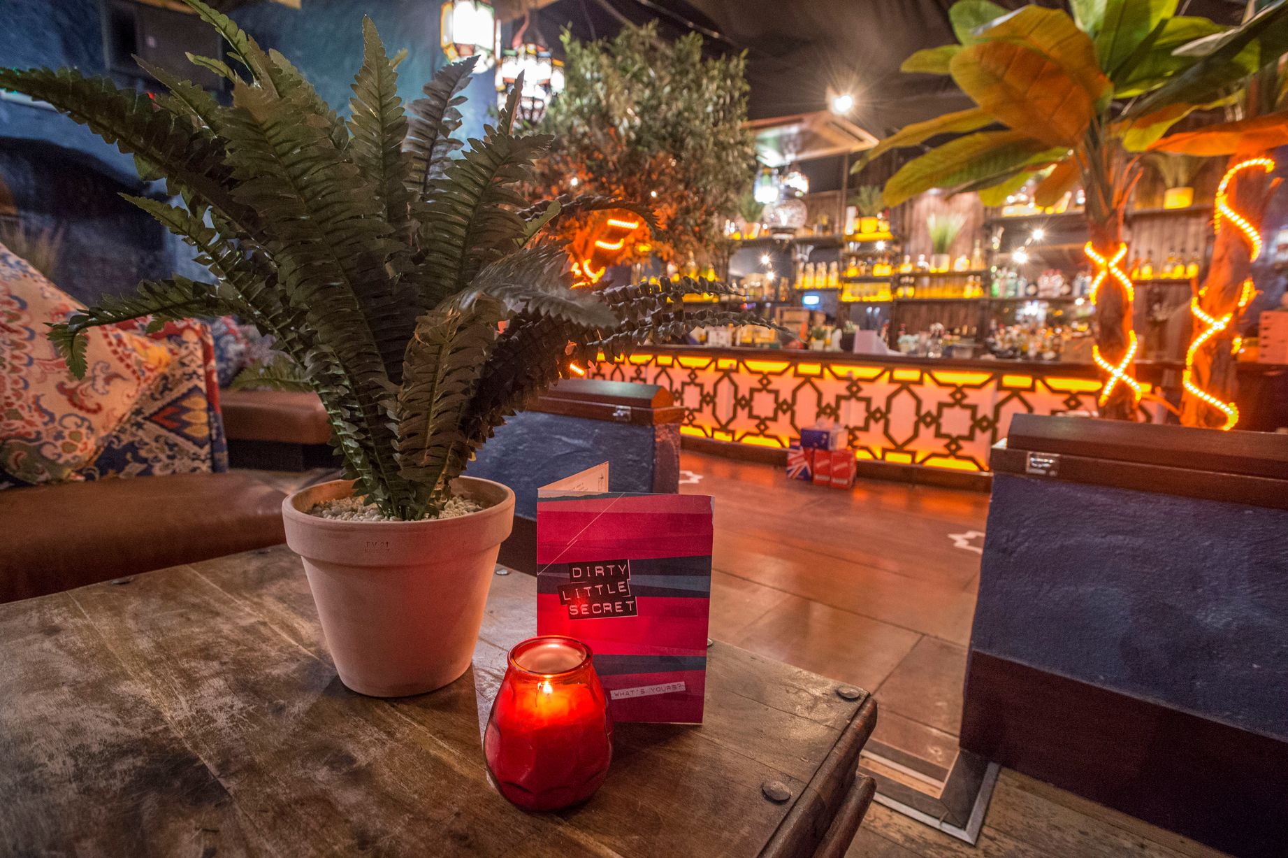 Vibrant event space with cozy decor, ideal for intimate gatherings and social events.