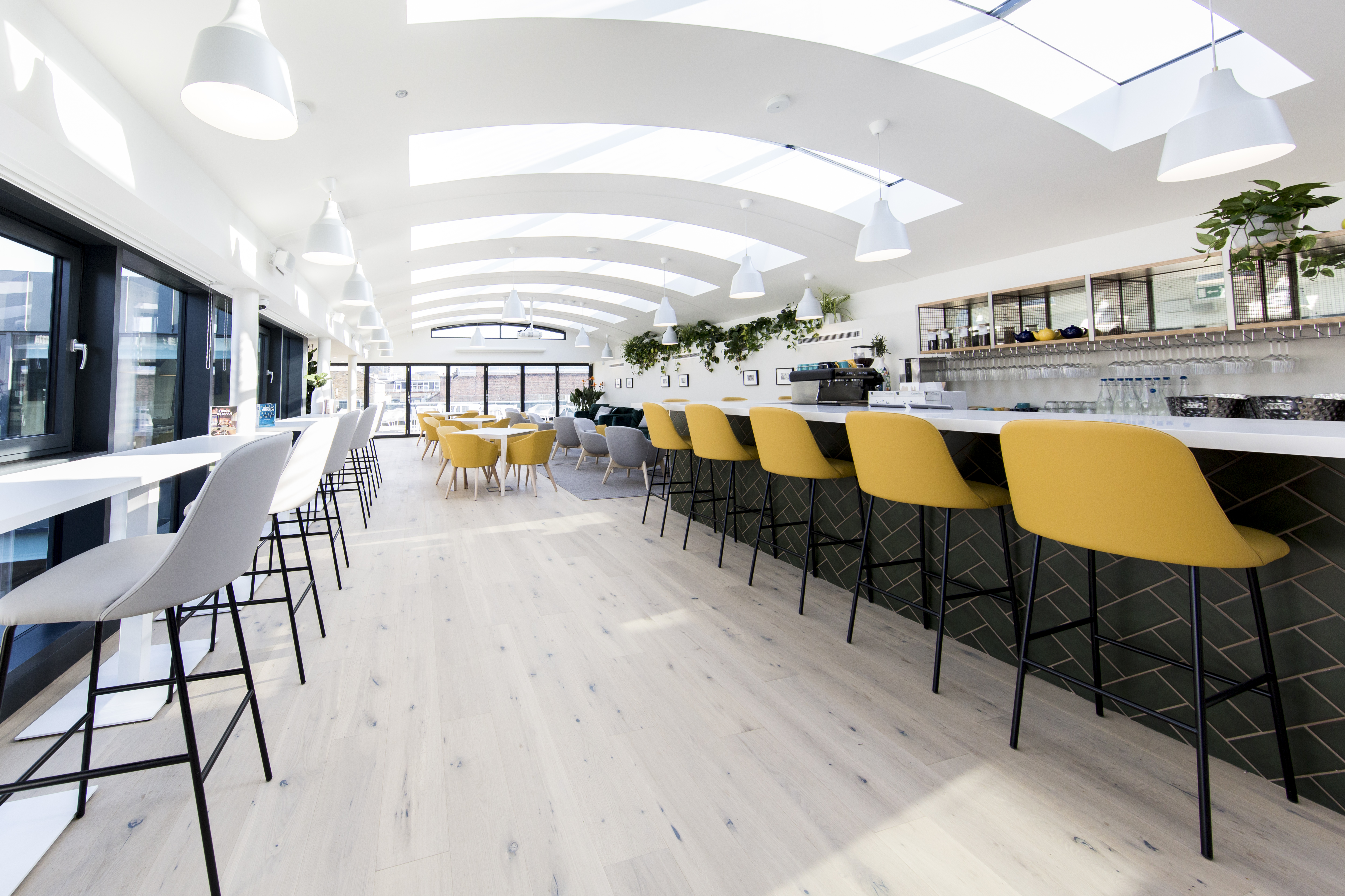 Gallery on 5 breakout area with bar seating for networking events and project meetings.