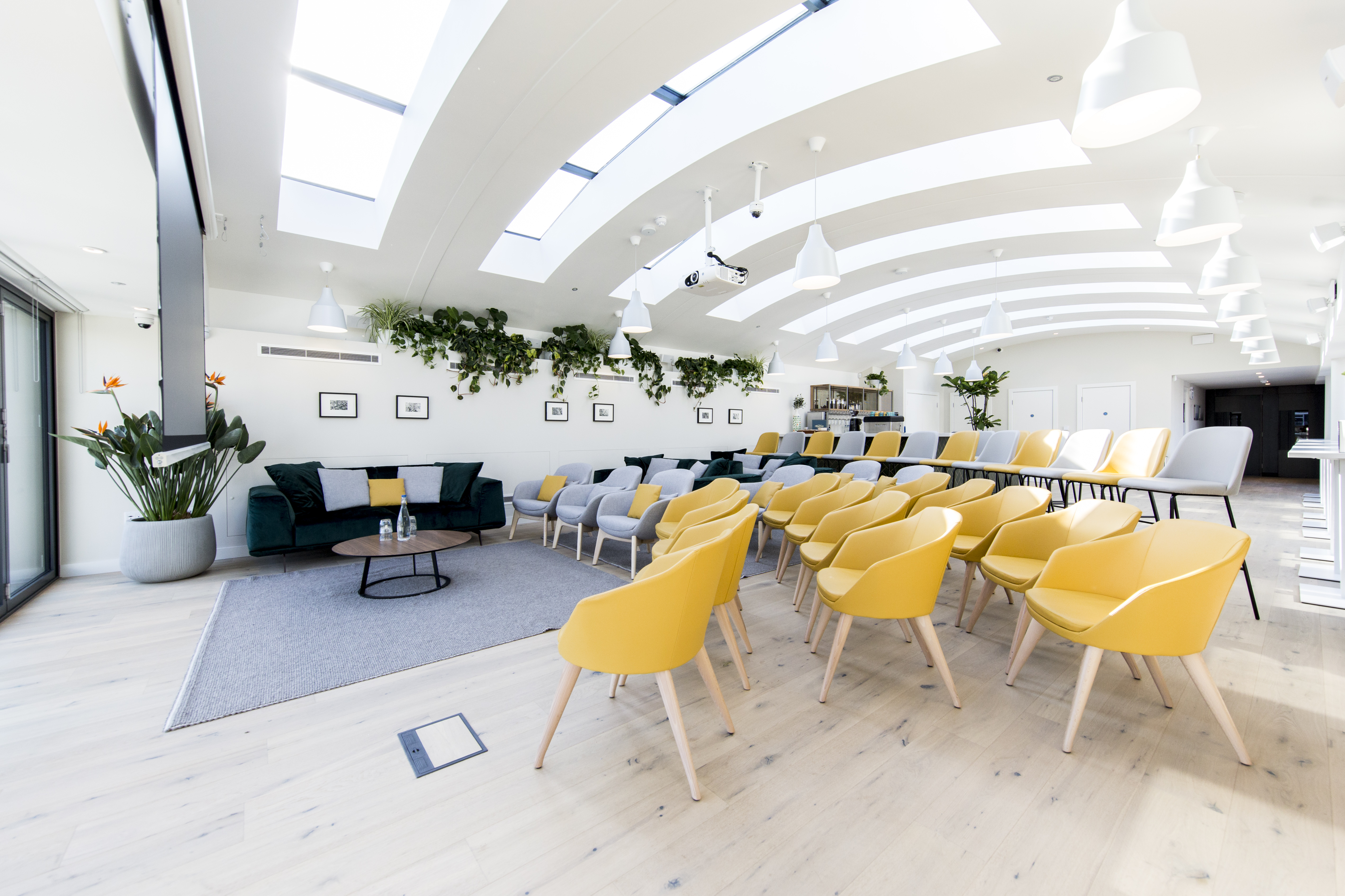 Gallery on 5 meeting space with theater seating, ideal for corporate workshops and fireside chats.