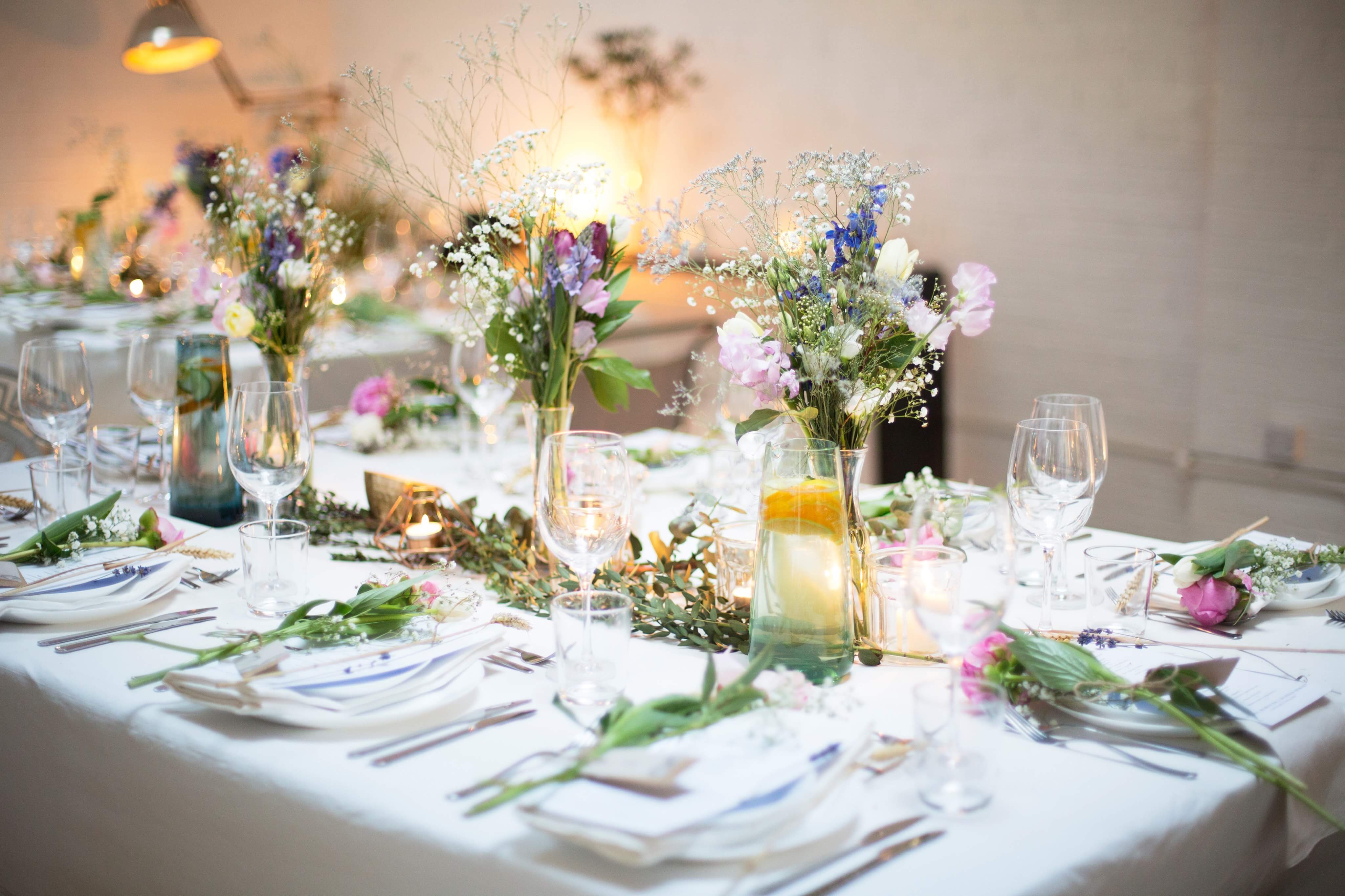 Elegant event table with floral centerpieces at STUDIO BLANK100 for memorable gatherings