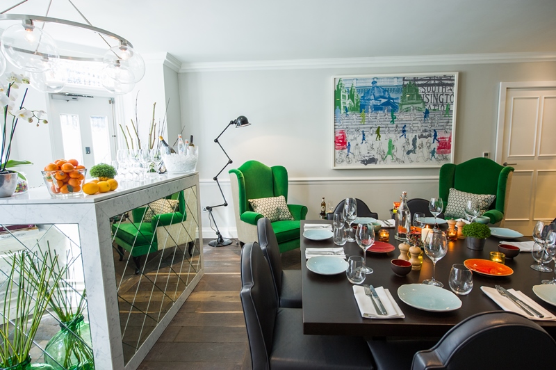 Stylish dining space at The Ampersand Hotel with vibrant green chairs for upscale events.