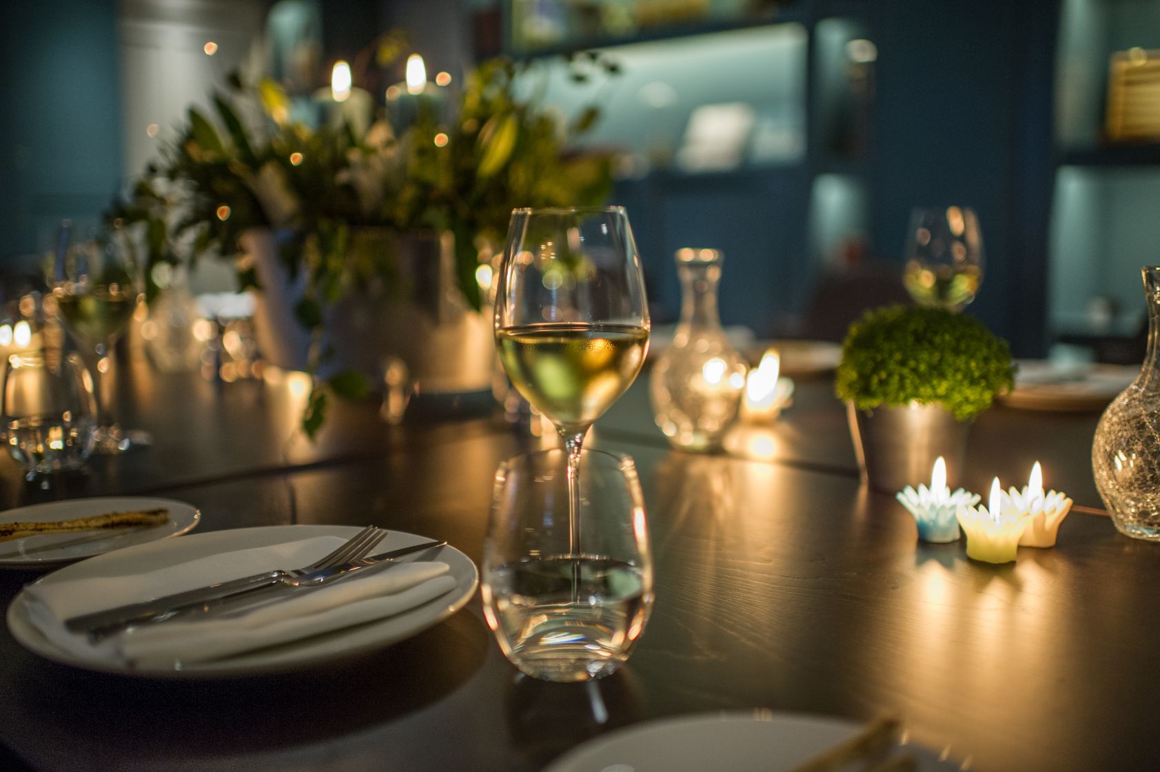 Elegant dining table with floral centerpiece at The Library, Ampersand Hotel event.