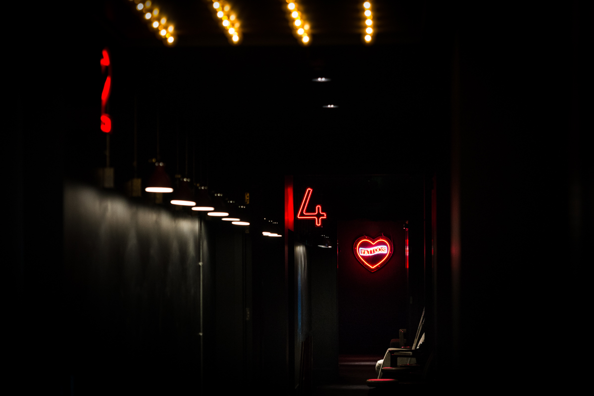Cinema screens and neon lights in Everyman Leeds for trendy events and parties.