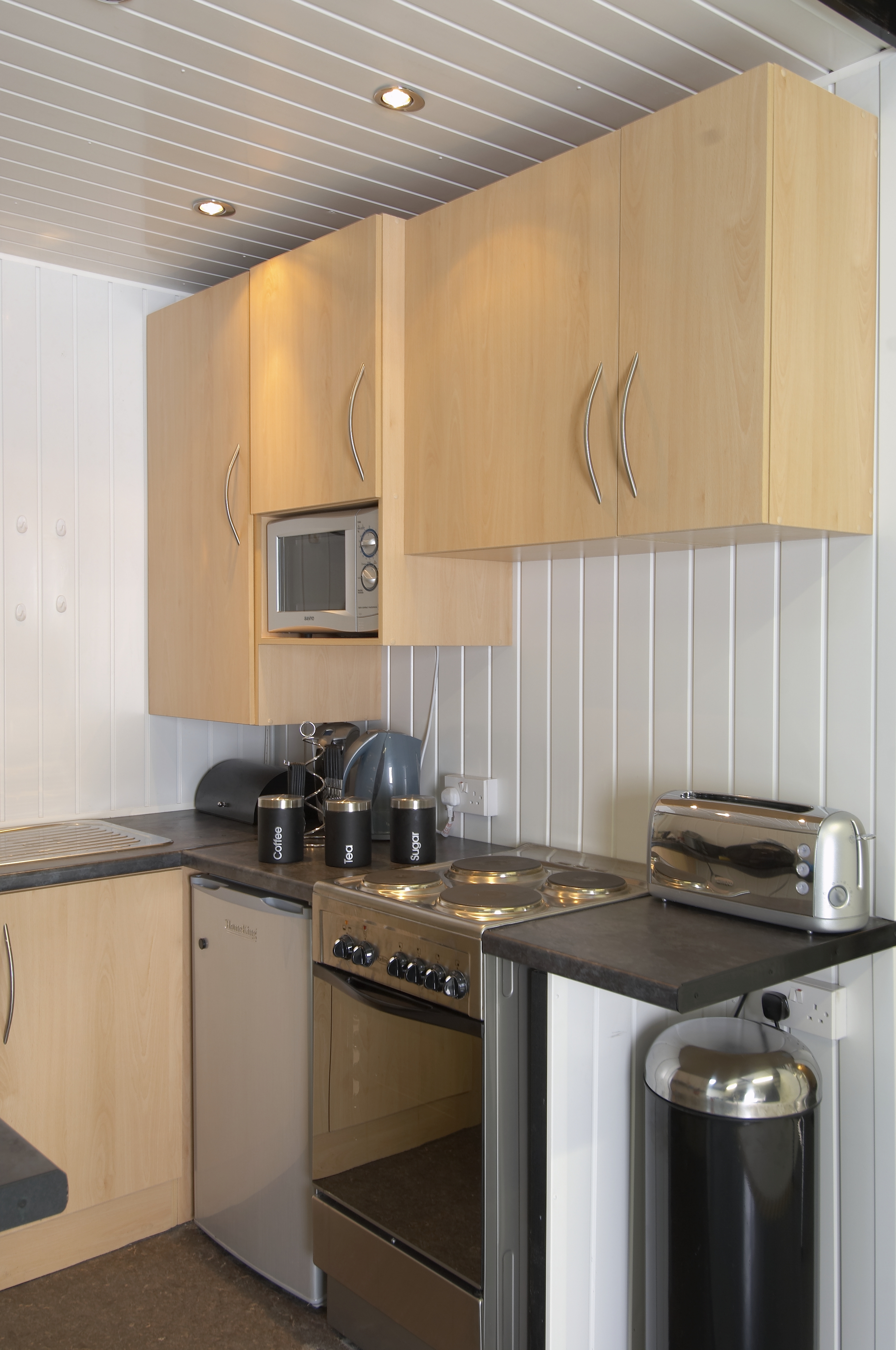 Infinity Cove kitchenette with appliances for efficient event catering and meetings.