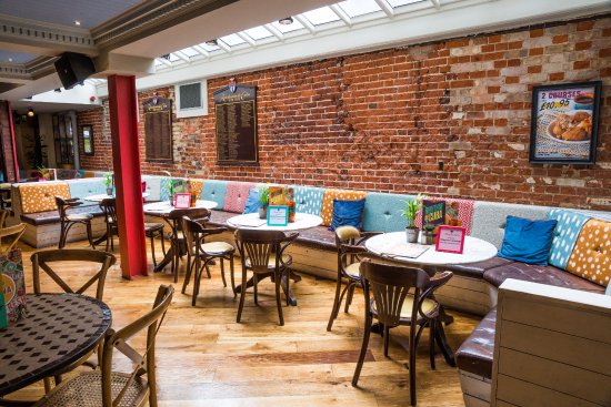 Vibrant event space with cozy seating for networking and casual gatherings in Norwich.