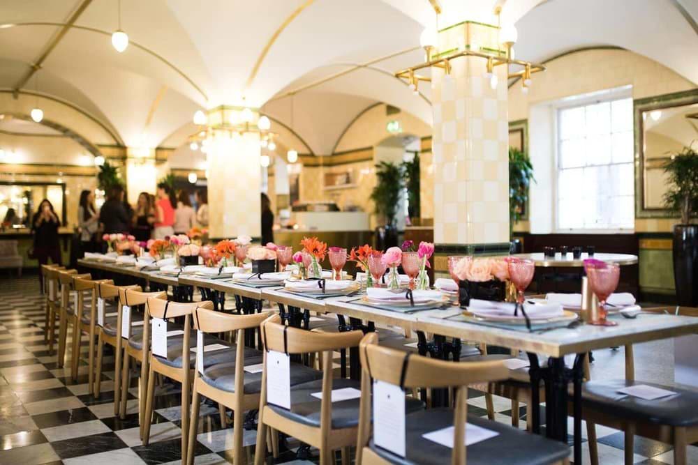 Elegant dining space at Café Duke, featuring floral centerpieces for events and gatherings.