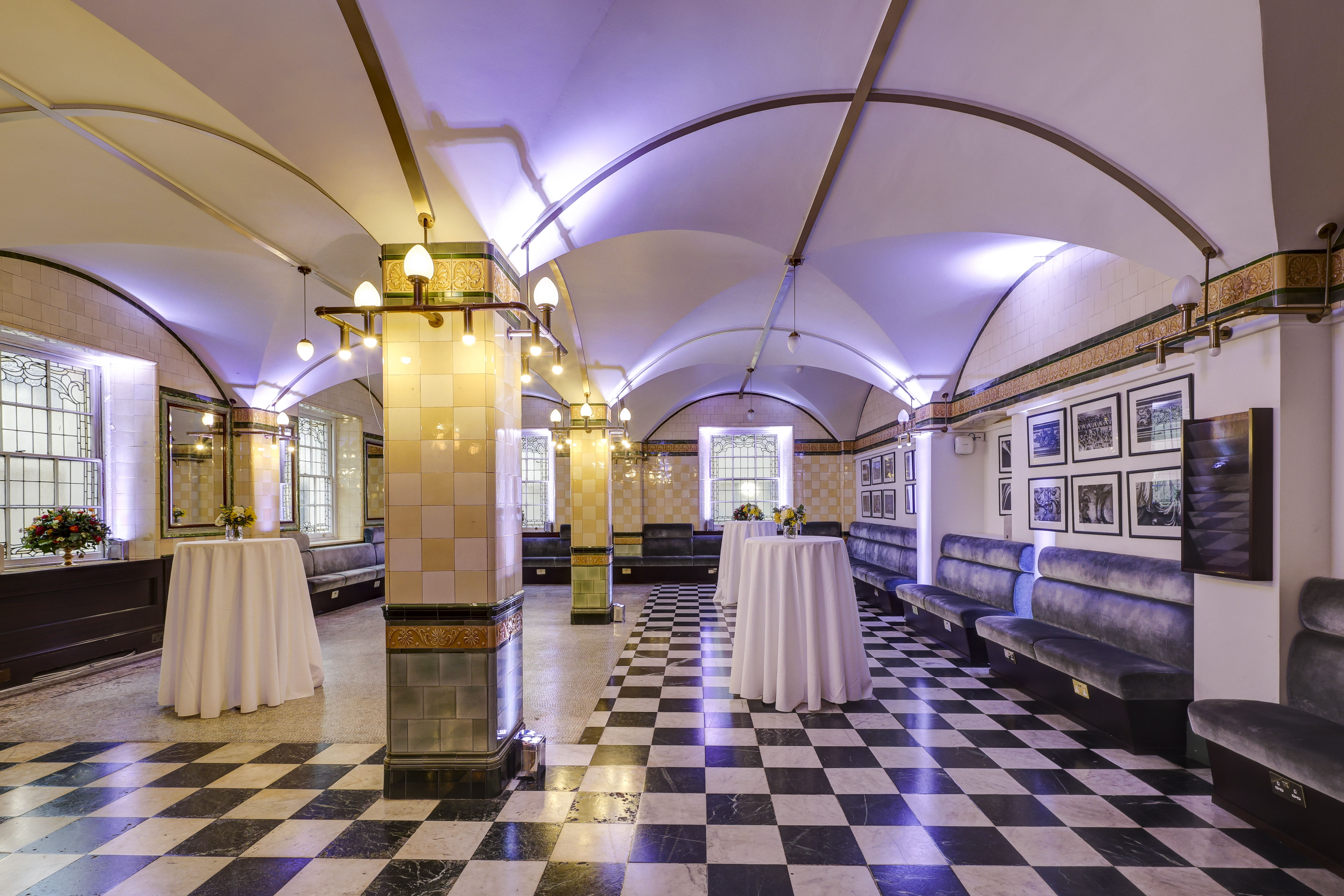 Café Duke event space with elegant archways, perfect for networking and cocktail receptions.