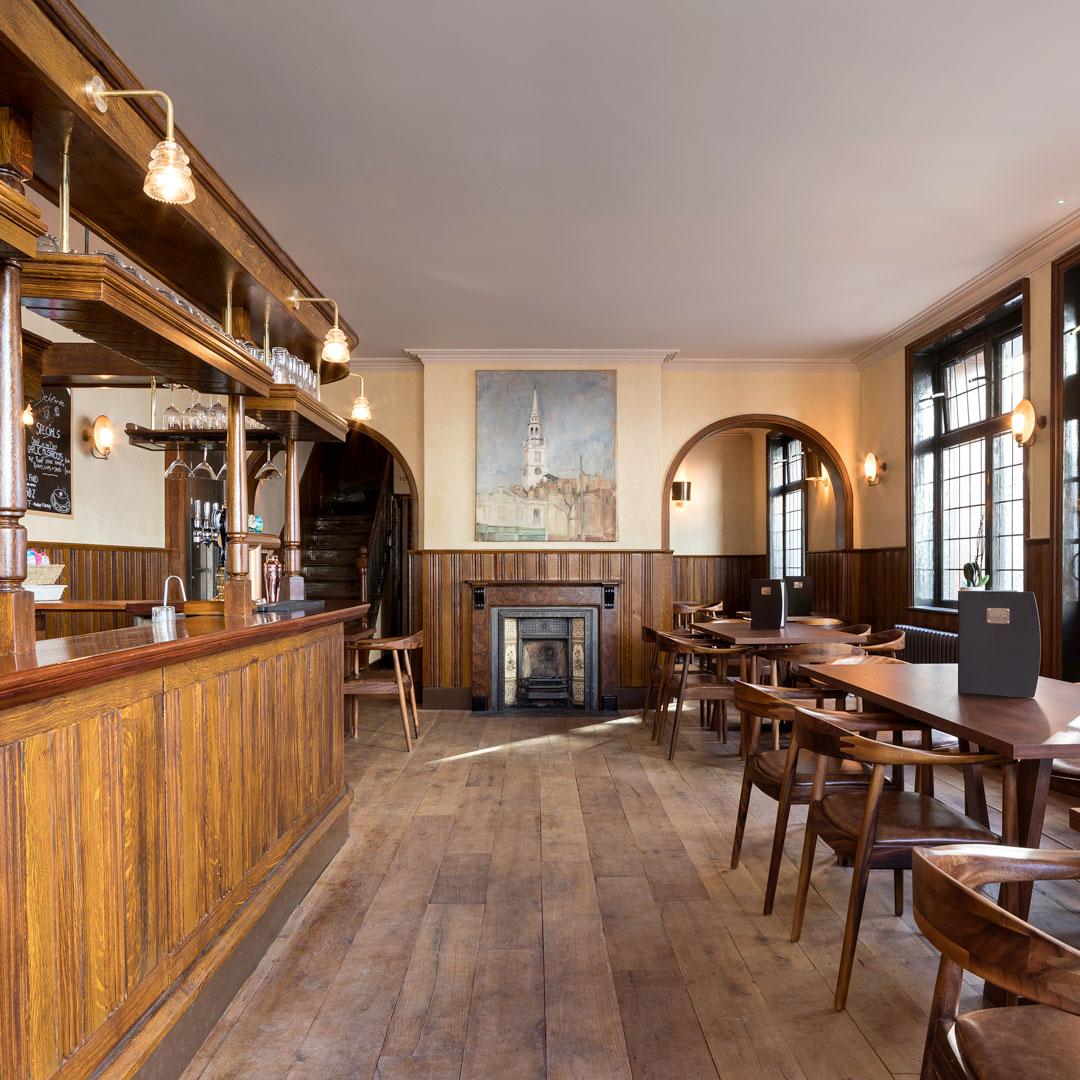 Charming ballroom with wooden accents, ideal for intimate gatherings and networking events.