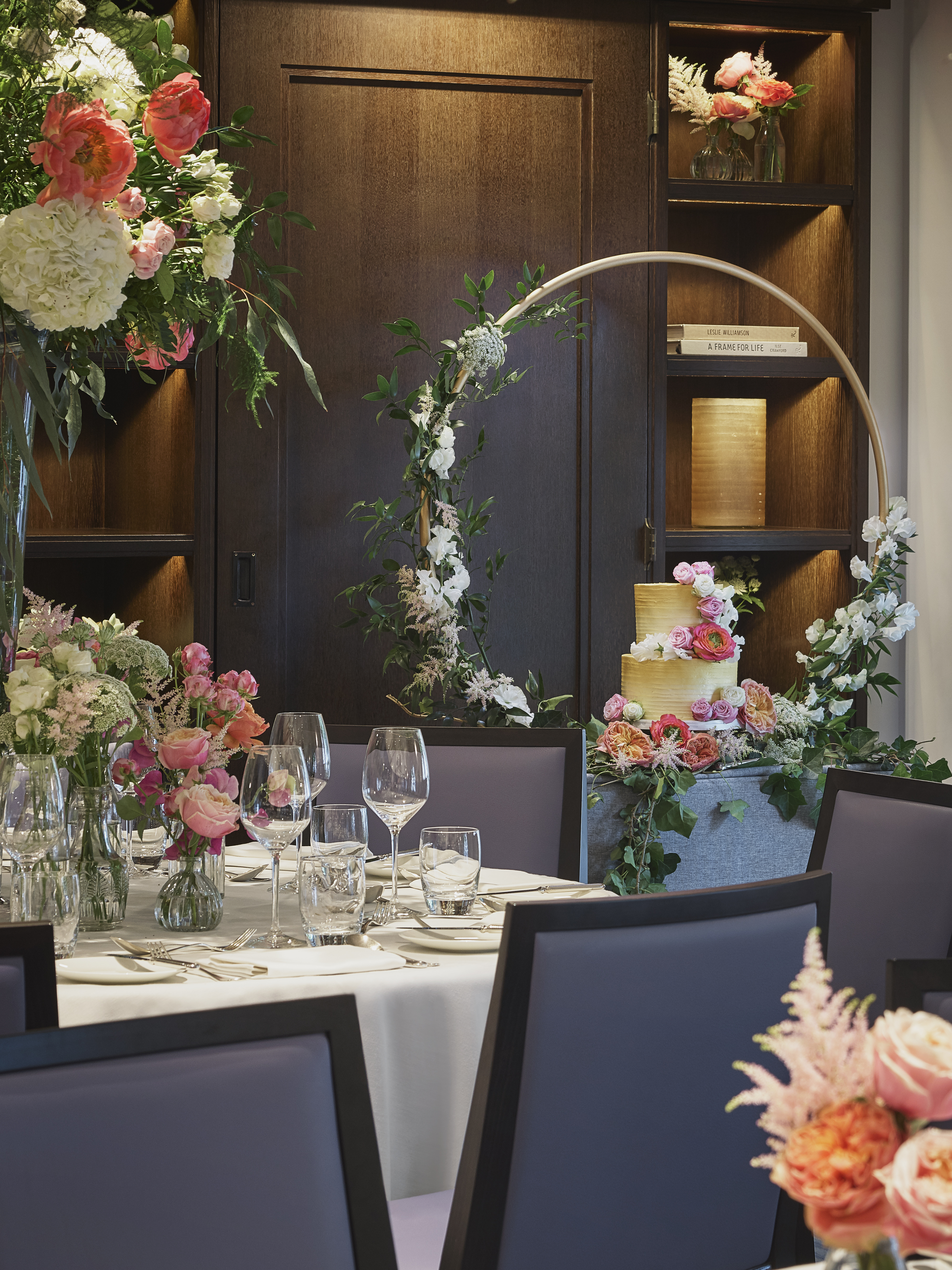 Elegant table with floral arrangements at The Type Room, One Aldwych for upscale events.
