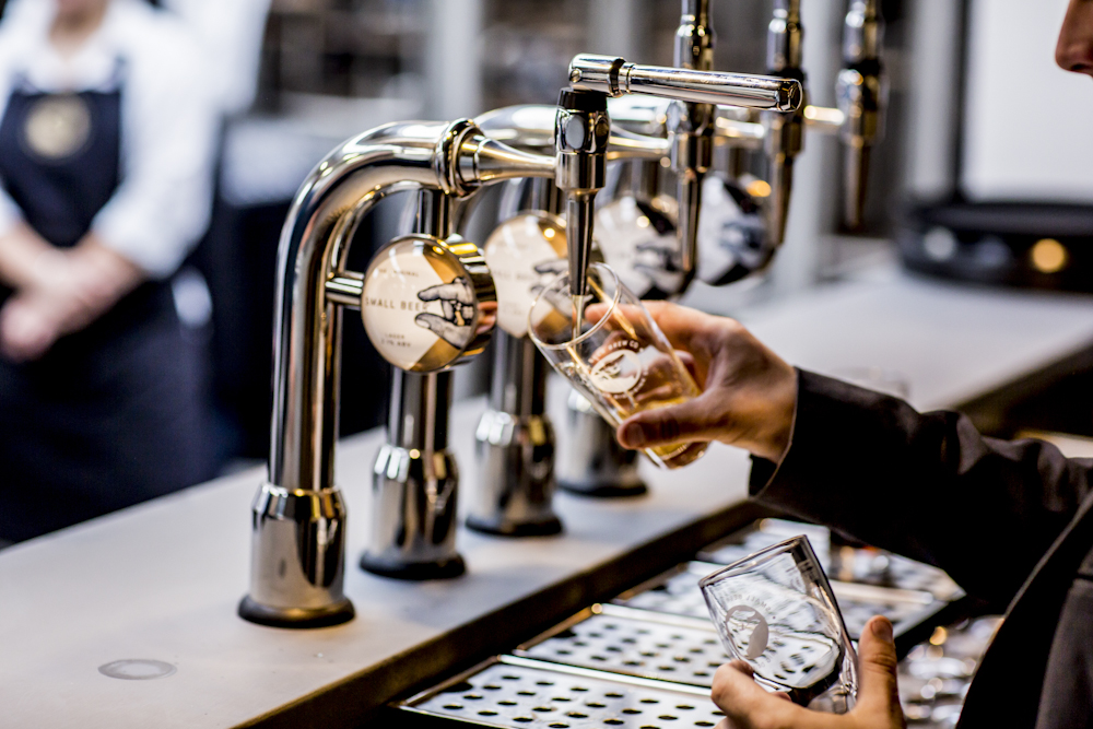 Sleek bar setup with polished taps at Small Beer Brewery's Main Brew Room for events.