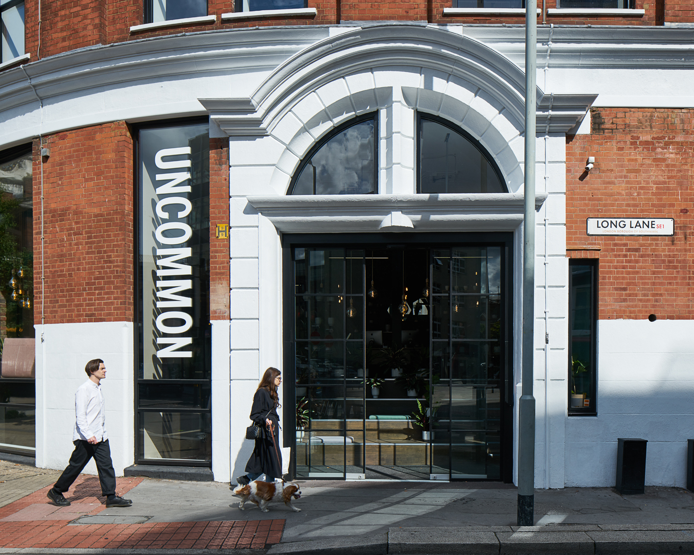 Contemporary meeting room with large windows at Uncommon Borough, perfect for creative events.