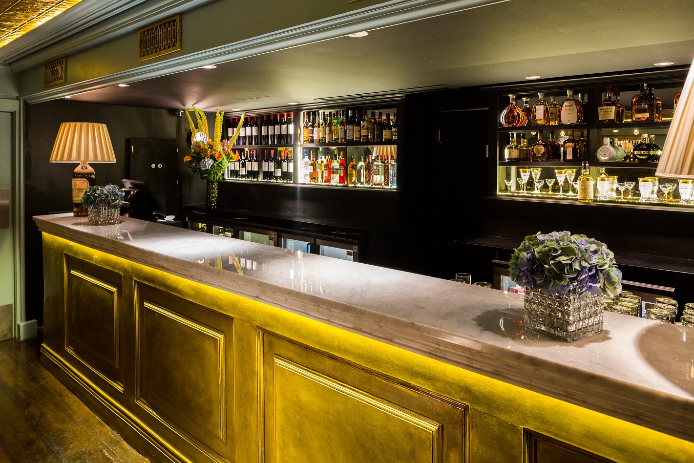 Sophisticated bar setup in Den Room at Bentley's for networking events and cocktail receptions.