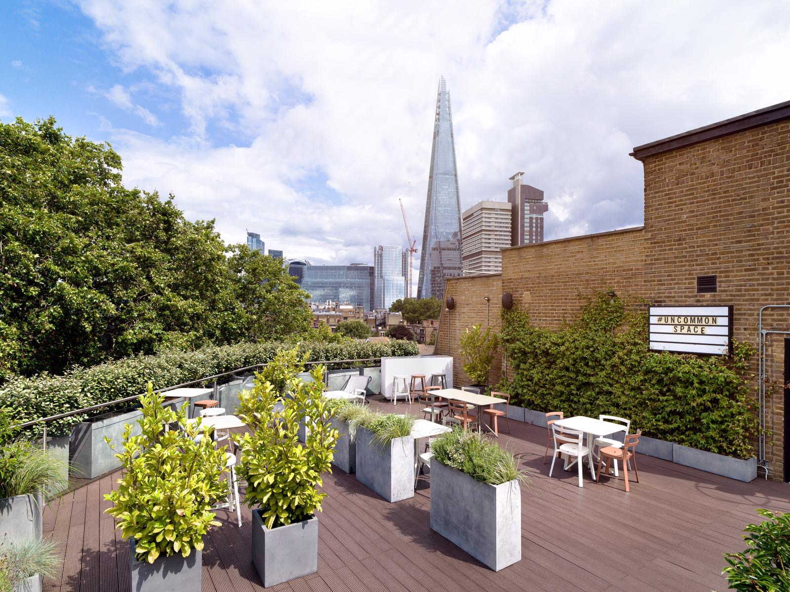 Roof Terrace at Uncommon Borough with skyline, ideal for outdoor meetings and events.