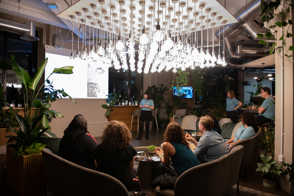 Cafe Lounge meeting space with chandelier, ideal for creative teamwork events.