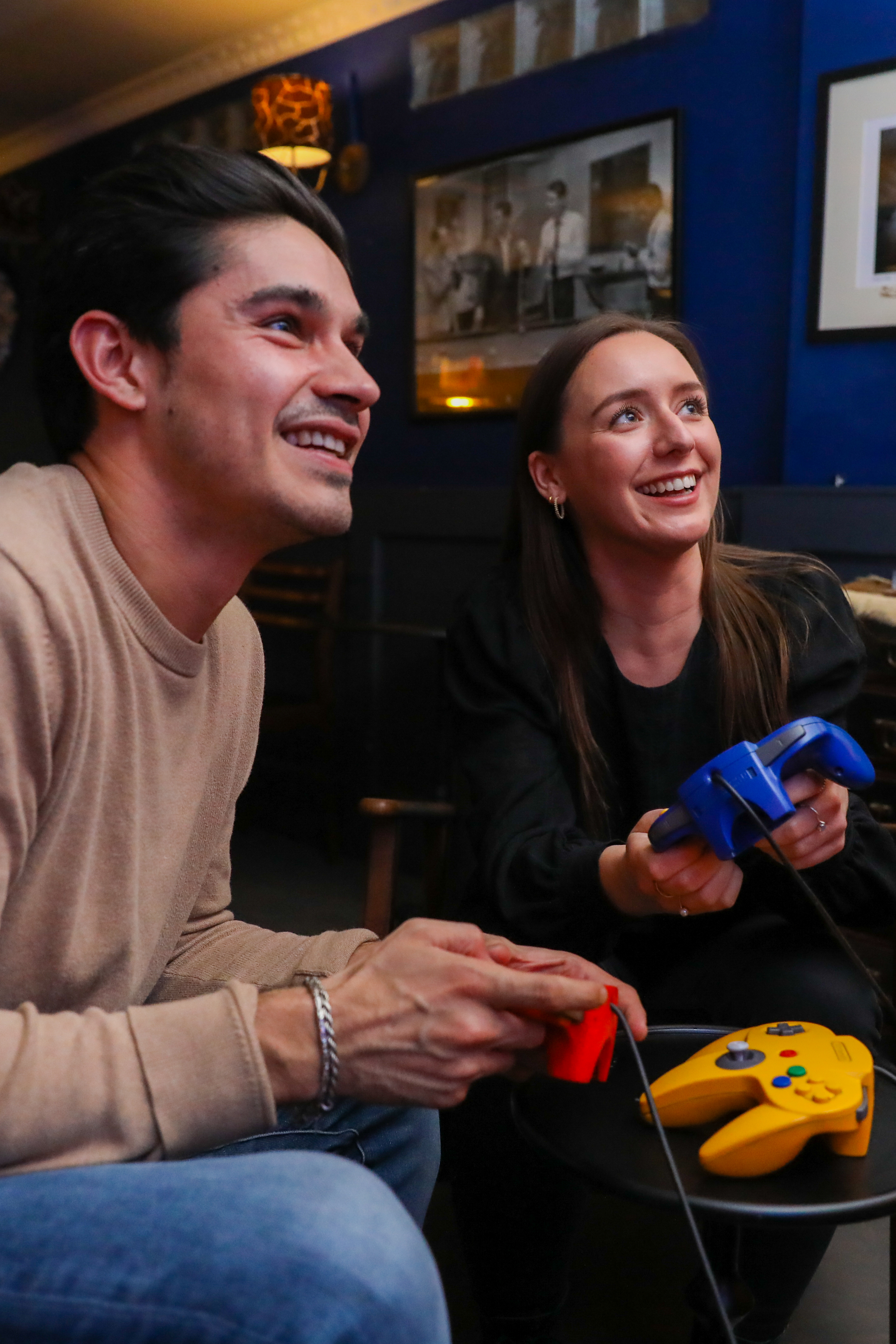 Two people conversing in a warm, inviting Living Room at a networking event.