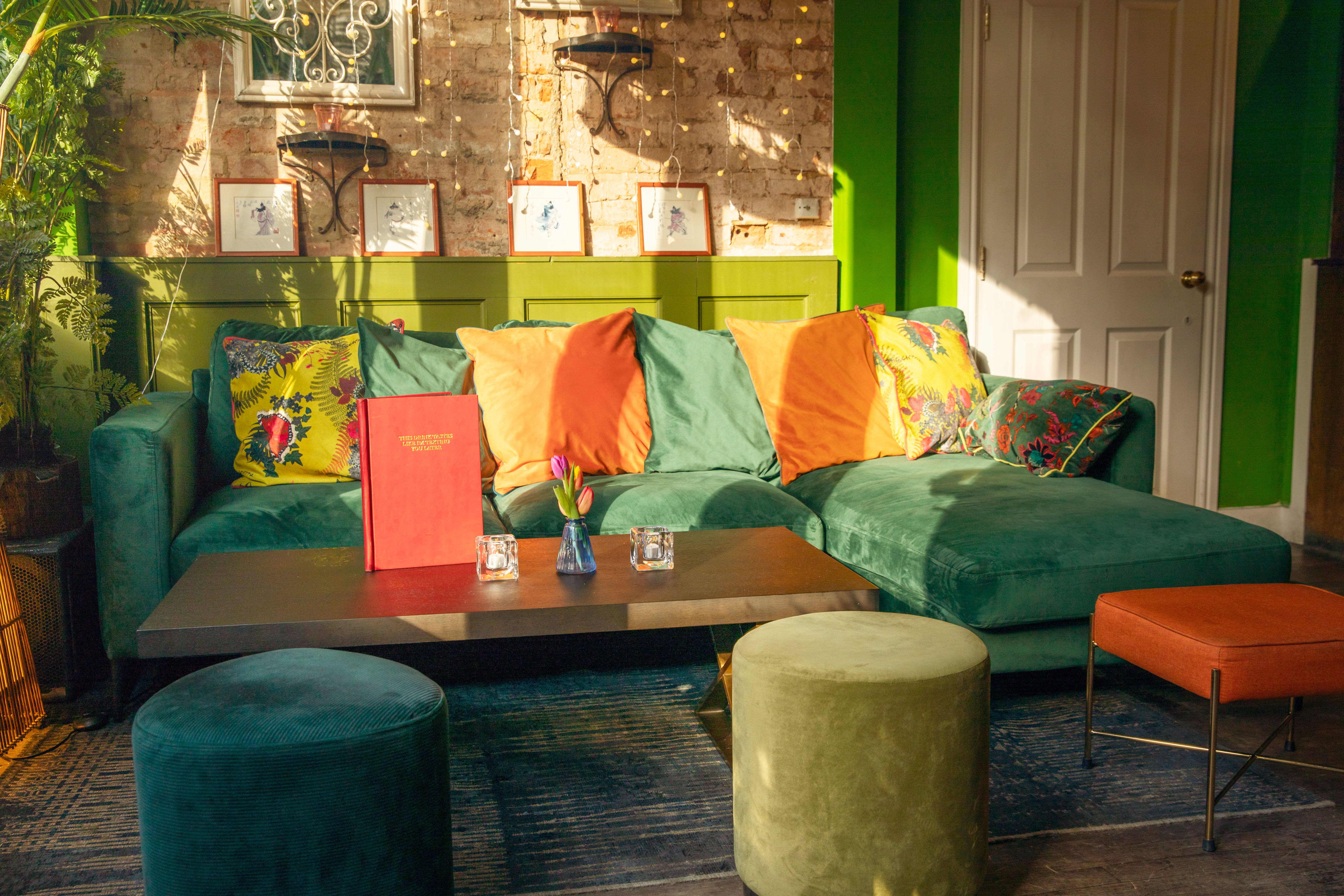 Vibrant lounge area with colorful cushions for networking events at The Little Blue Door.