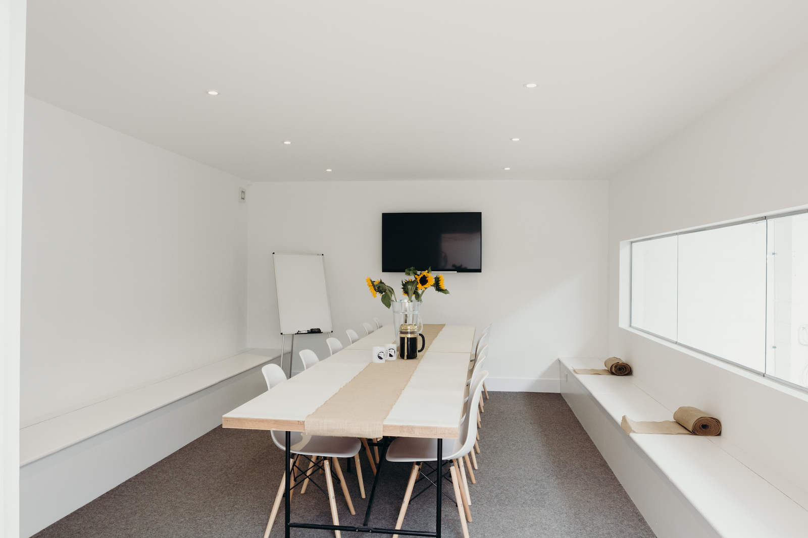 Modern boardroom with wooden table, ideal for meetings and events at Small Beer Brewery.
