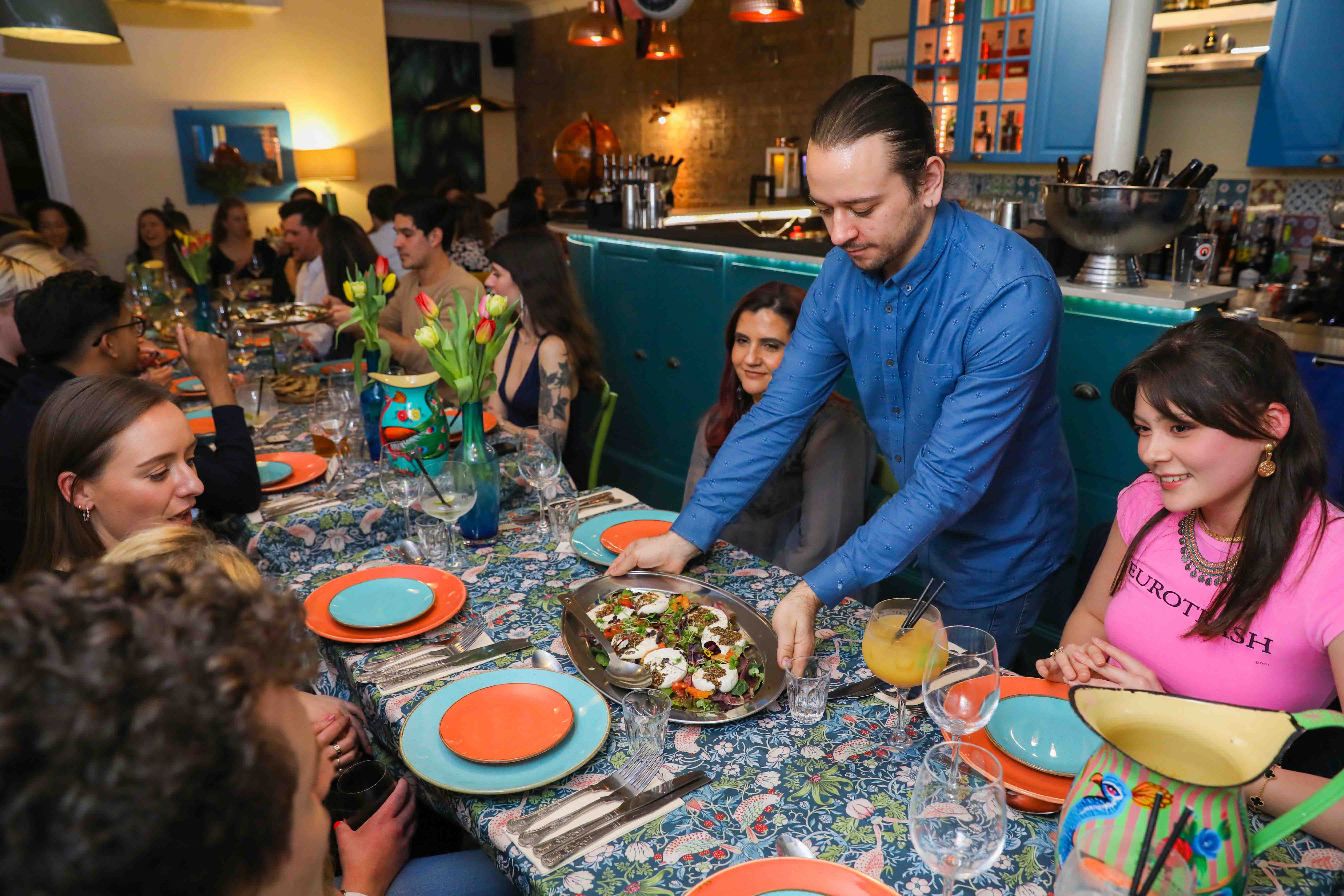 Vibrant dining setup at The Little Blue Door, perfect for social or corporate events.